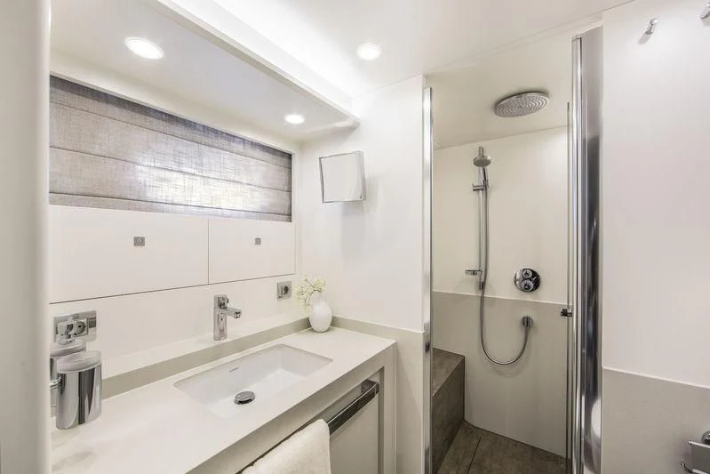 a bathroom with a shower and sink aboard NICOSTASIA Yacht for Sale