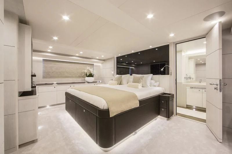a large bedroom with a large bed aboard NICOSTASIA Yacht for Sale