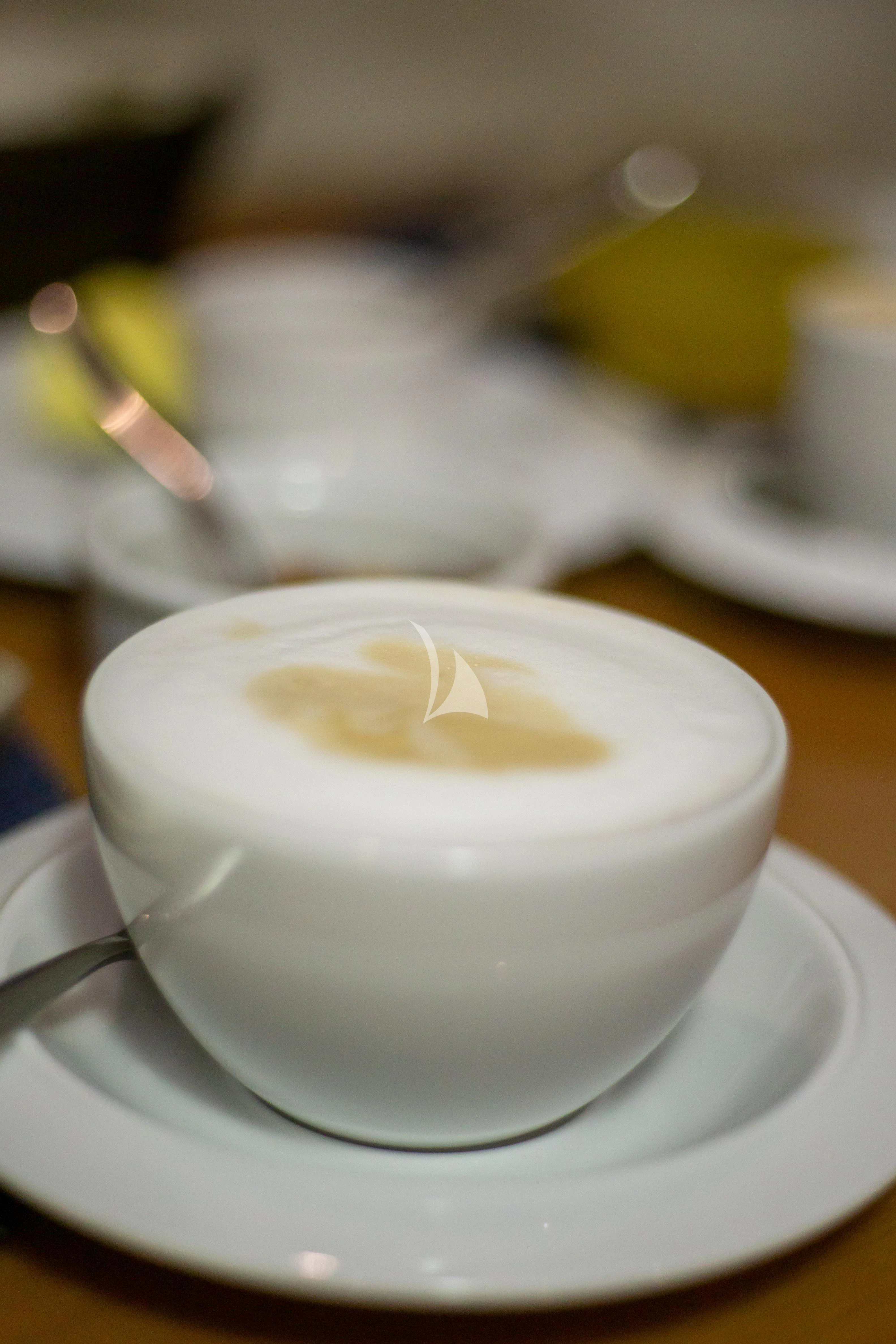 a white cup with a white substance on it aboard NOMADA Yacht for Charter