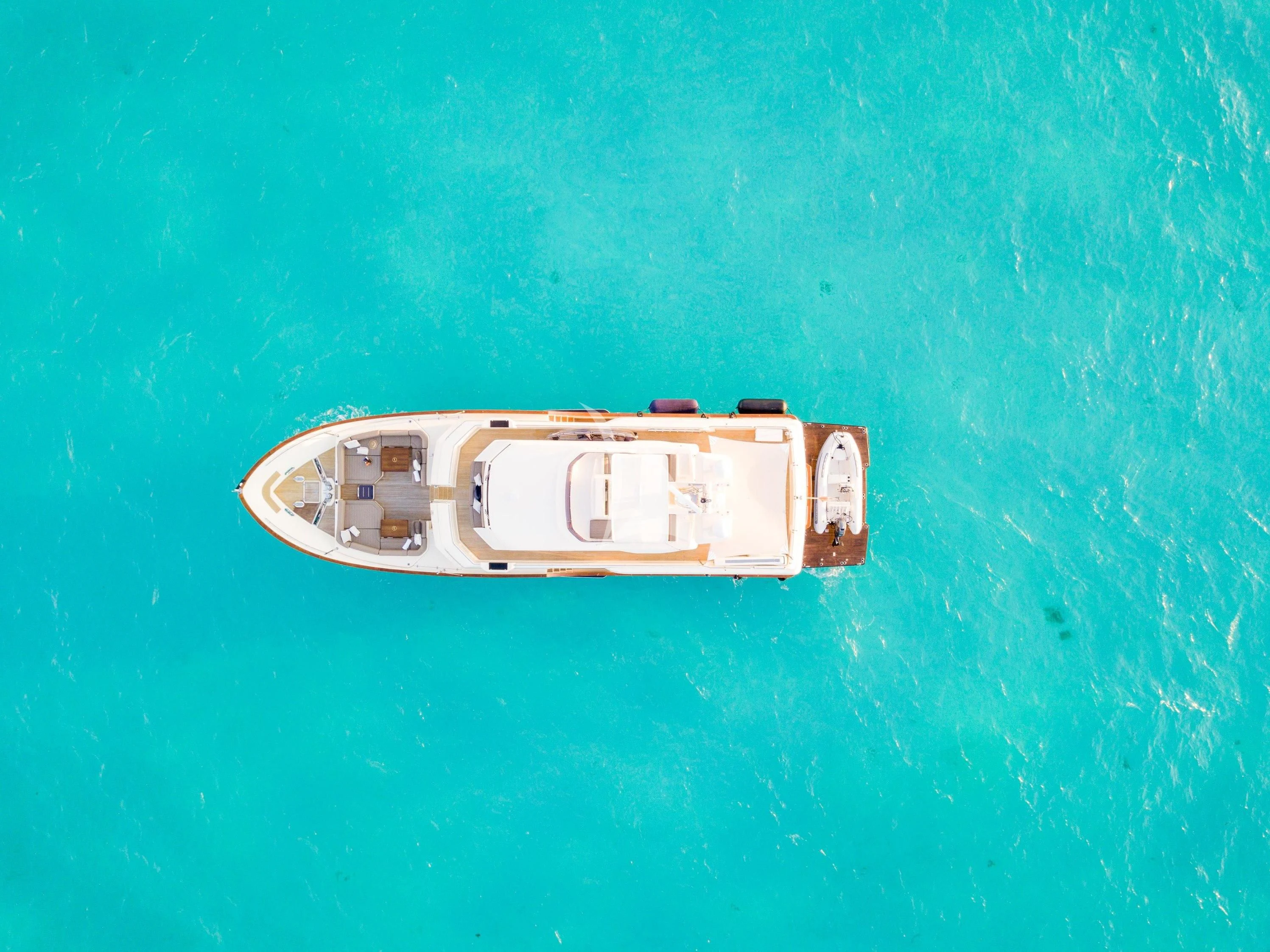 a small boat on the water aboard NOMADA Yacht for Charter