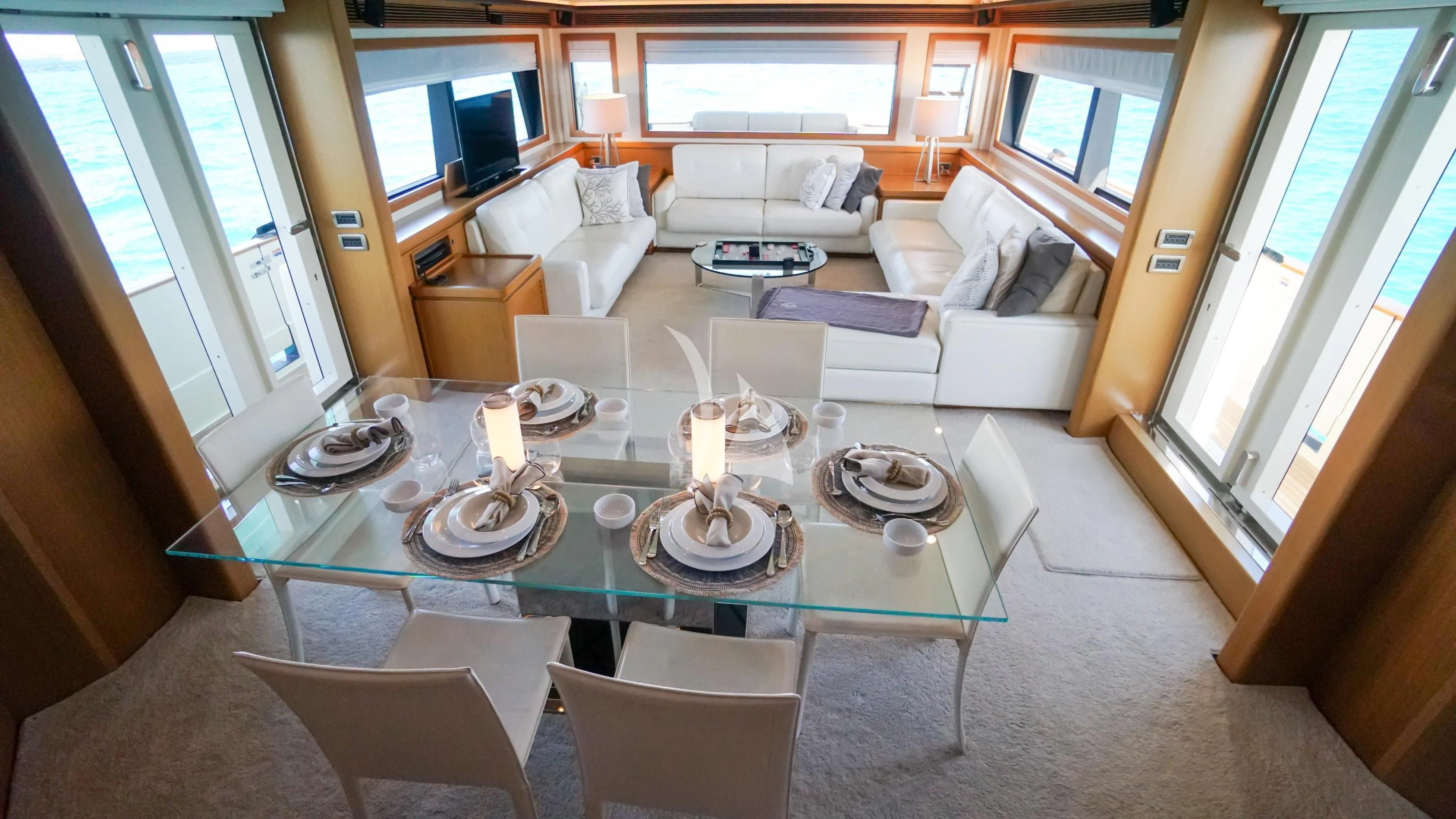 a living room with a table and chairs aboard NOMADA Yacht for Charter