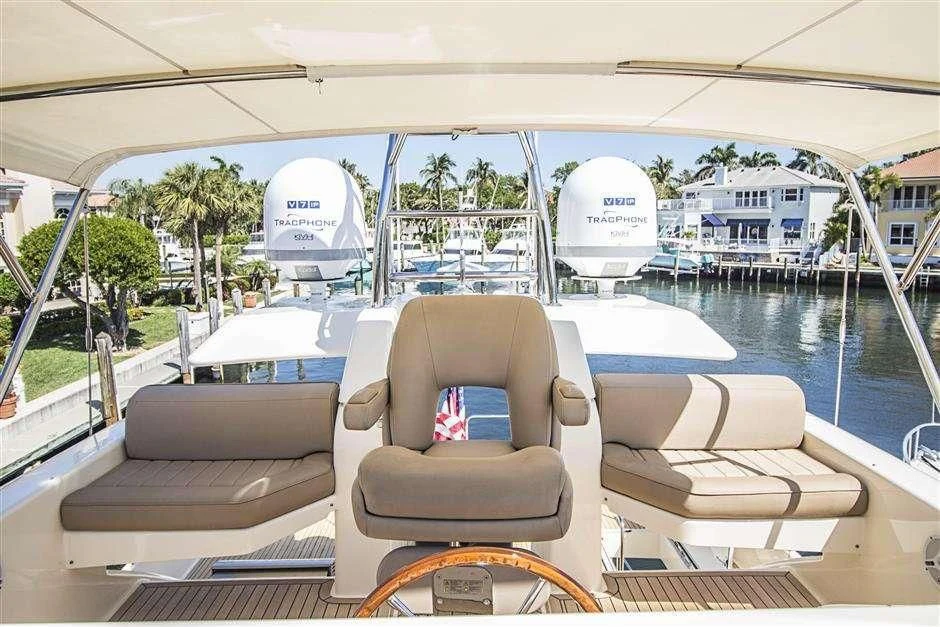 a boat with chairs and a table on it aboard NOMADA Yacht for Charter