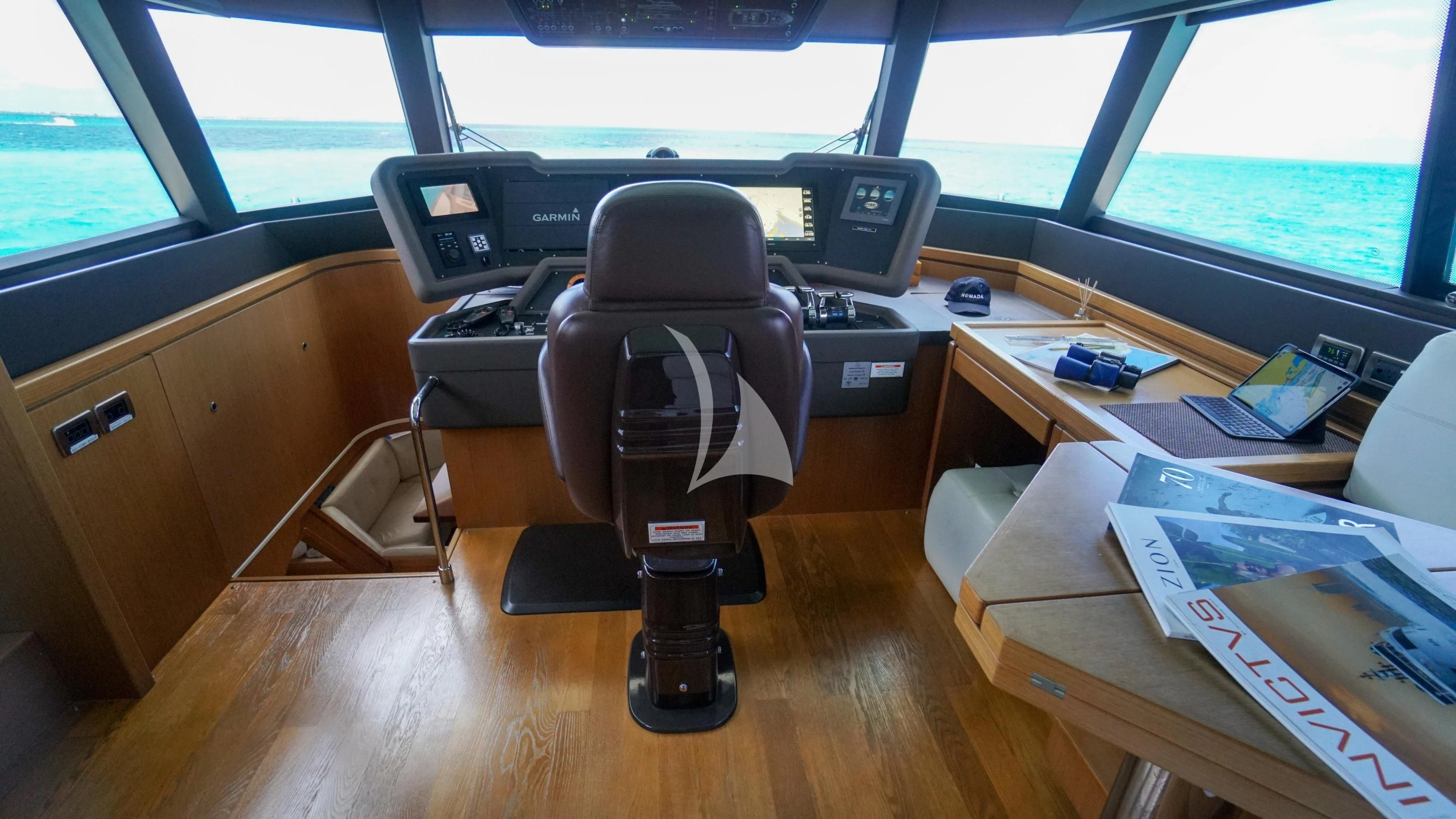 a chair in a room aboard NOMADA Yacht for Charter