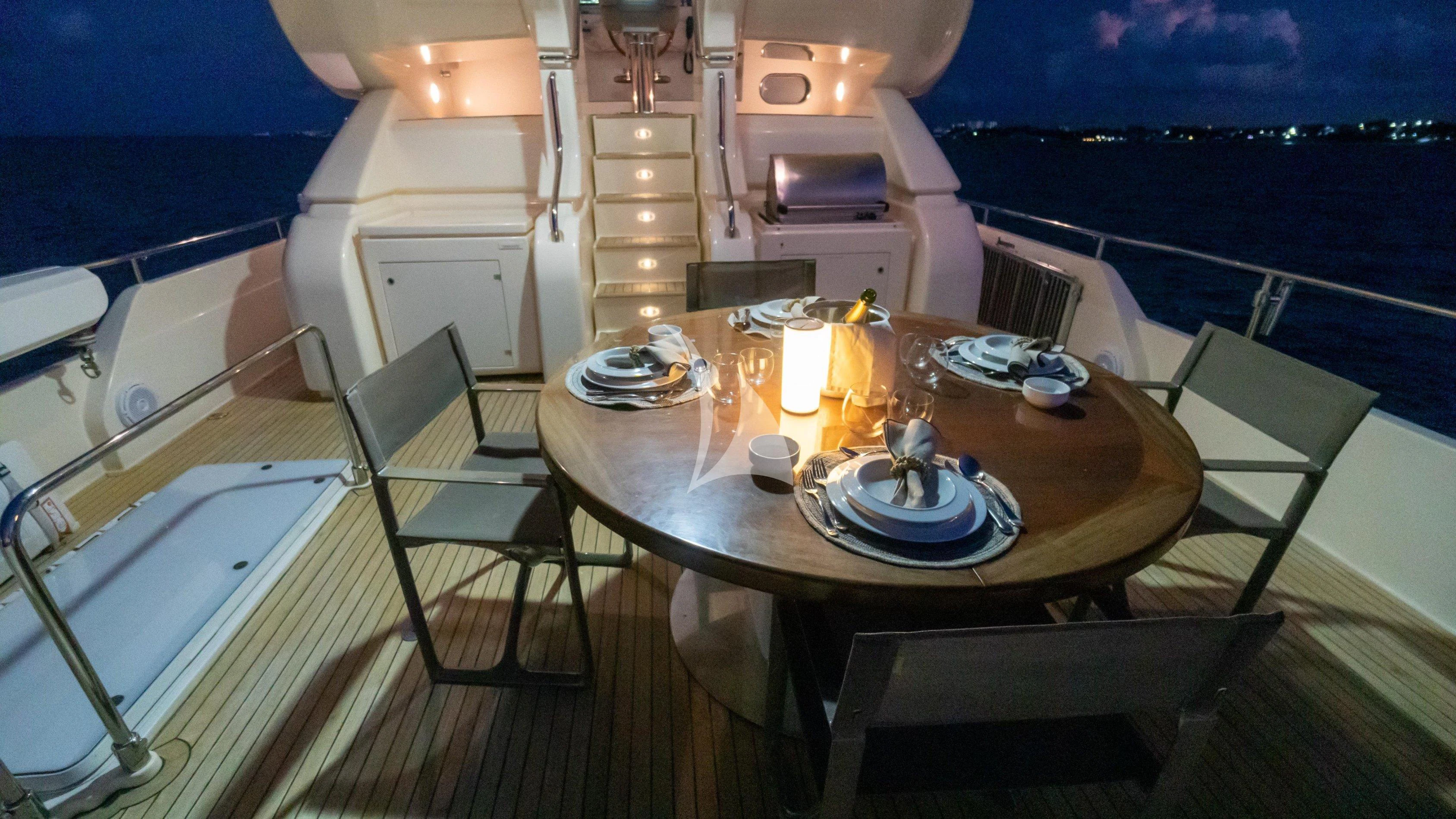 a table with candles on it aboard NOMADA Yacht for Charter