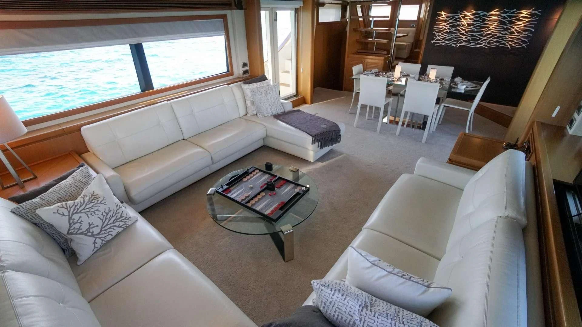 a living room with a couch and a table aboard NOMADA Yacht for Charter