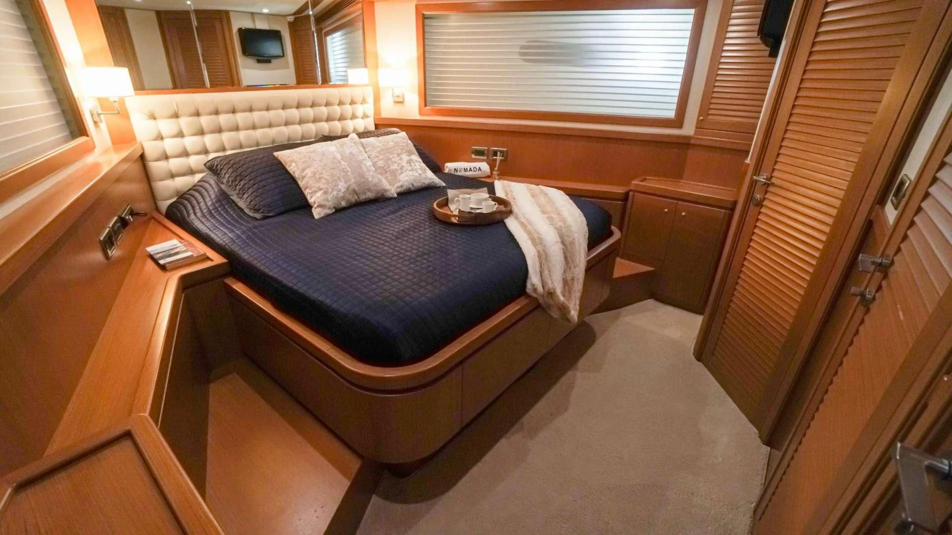 a bed in a room aboard NOMADA Yacht for Charter
