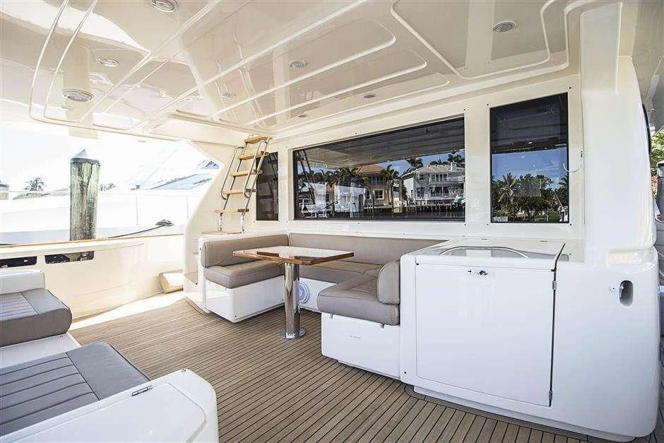 a room with a couch and a table aboard NOMADA Yacht for Charter