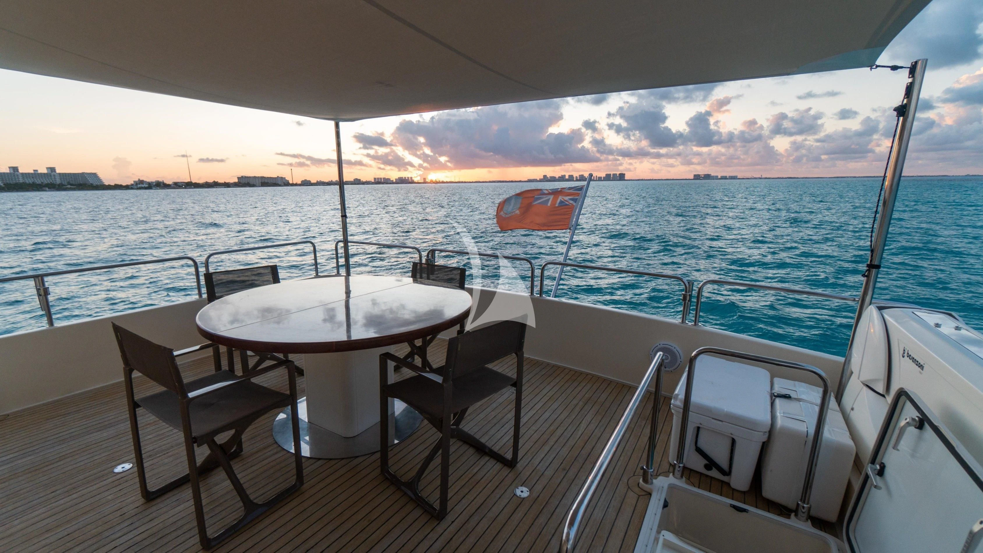 a table and chairs on a boat aboard NOMADA Yacht for Charter