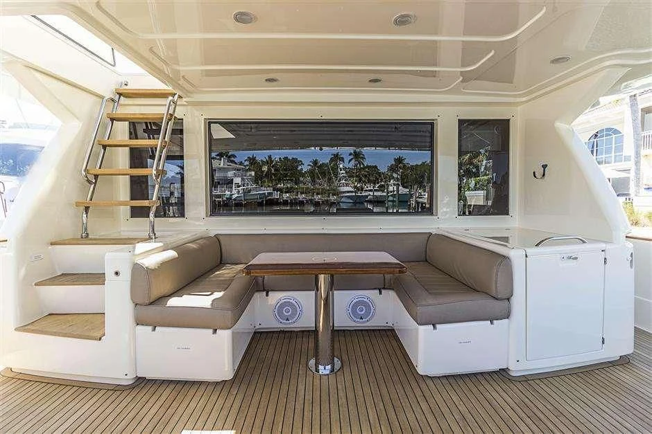 a living room with a couch and a table aboard NOMADA Yacht for Charter