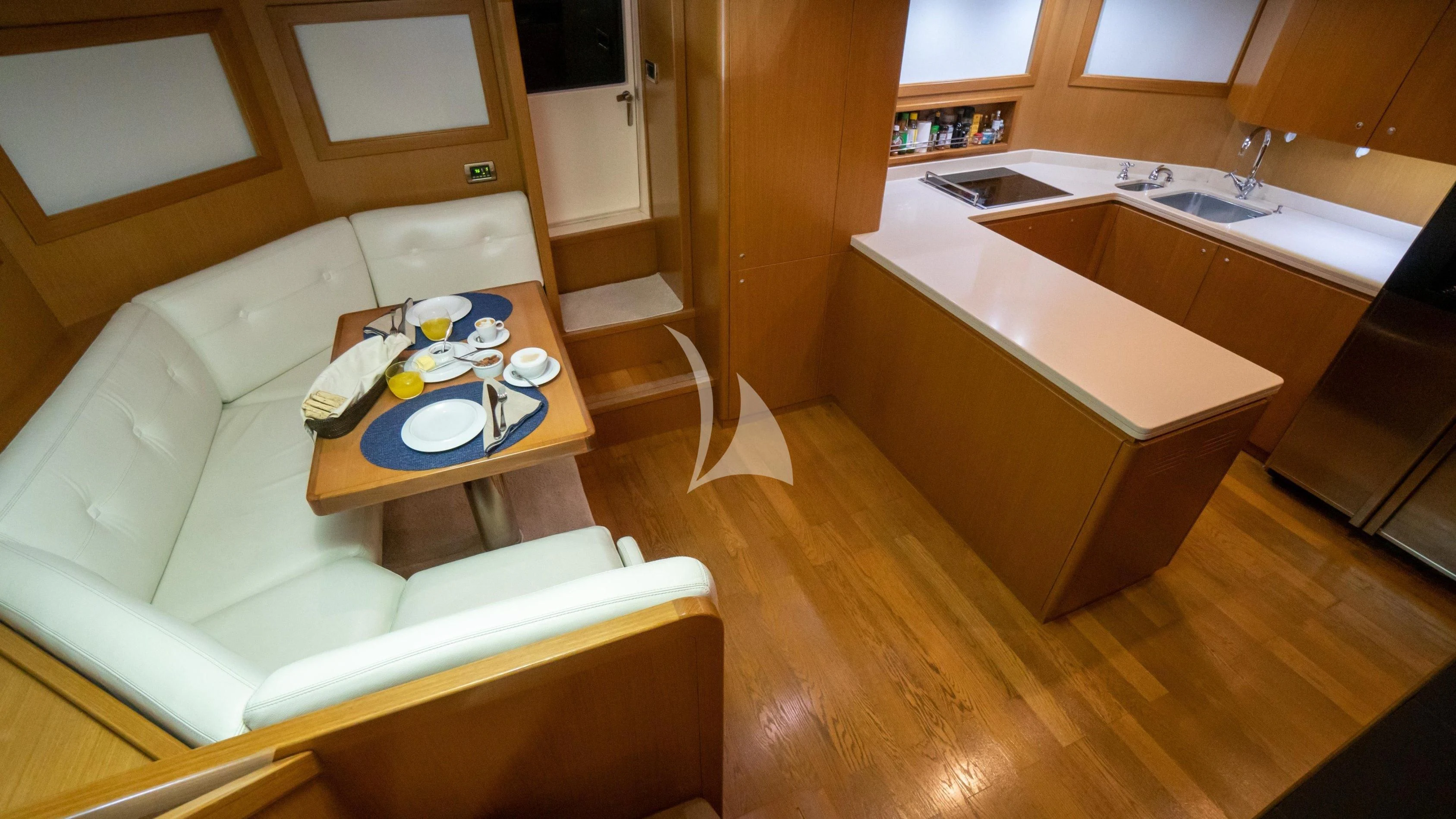 a living room with a couch and a table aboard NOMADA Yacht for Charter