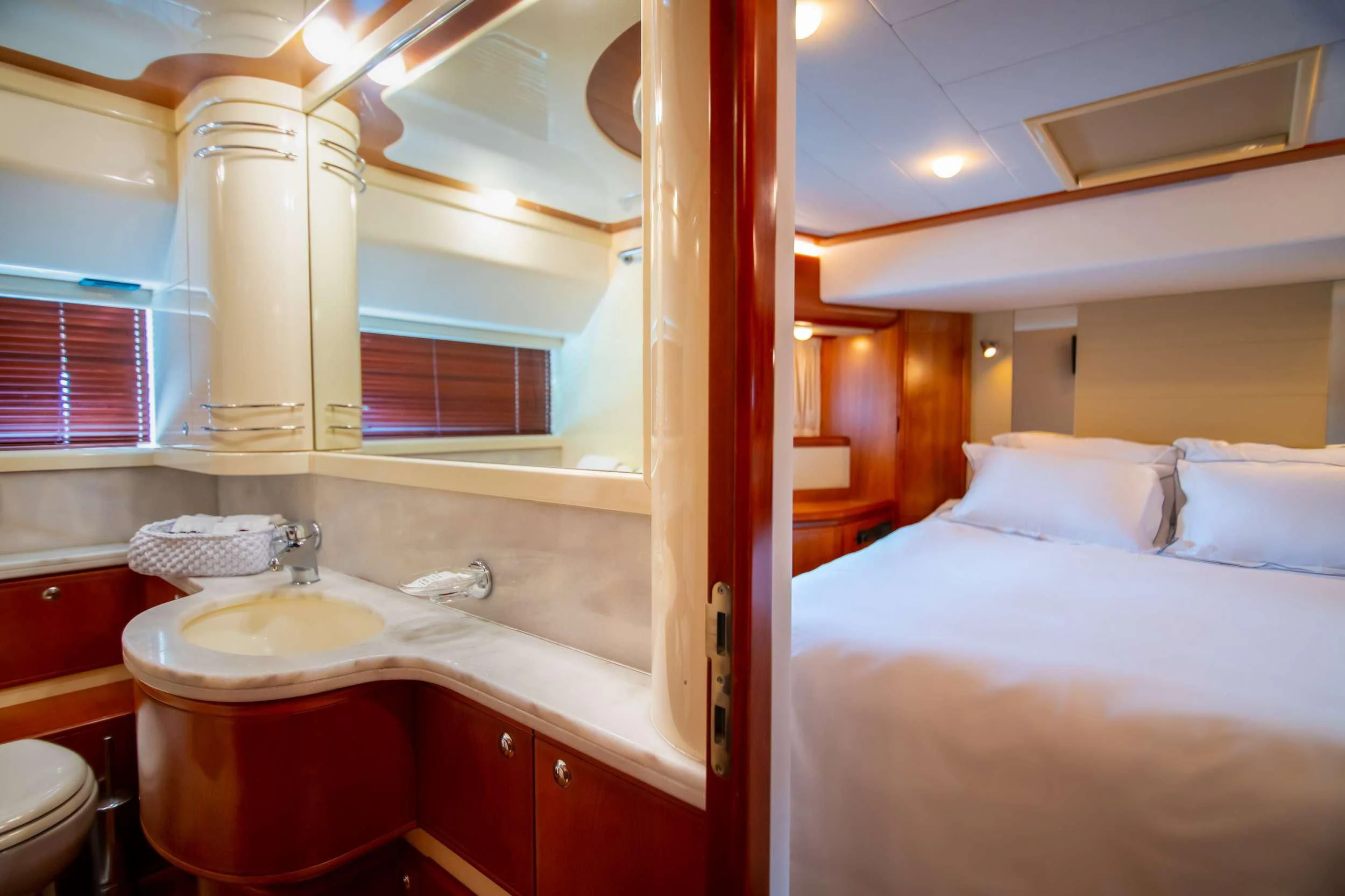a bathroom with a sink and a bed aboard SOFIA D Yacht for Sale