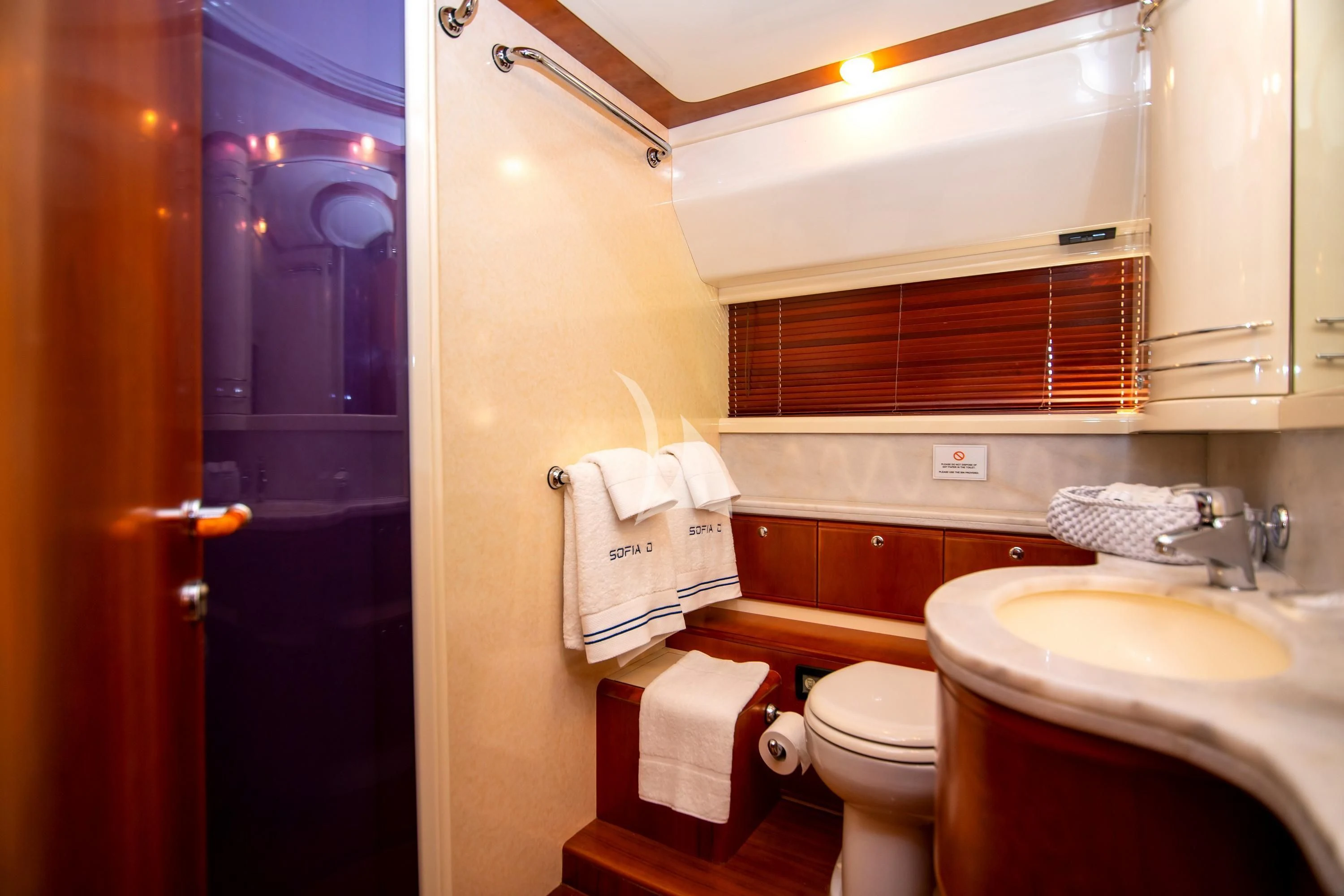 a bathroom with a toilet and sink aboard SOFIA D Yacht for Sale