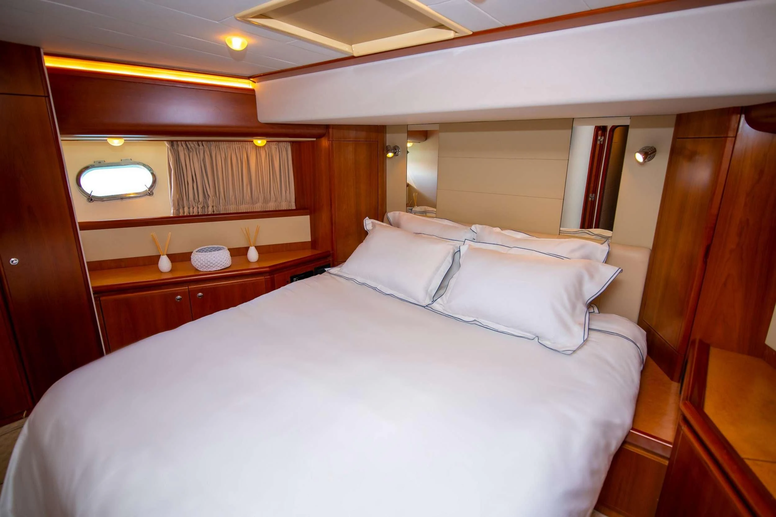 a bed with white sheets aboard SOFIA D Yacht for Sale
