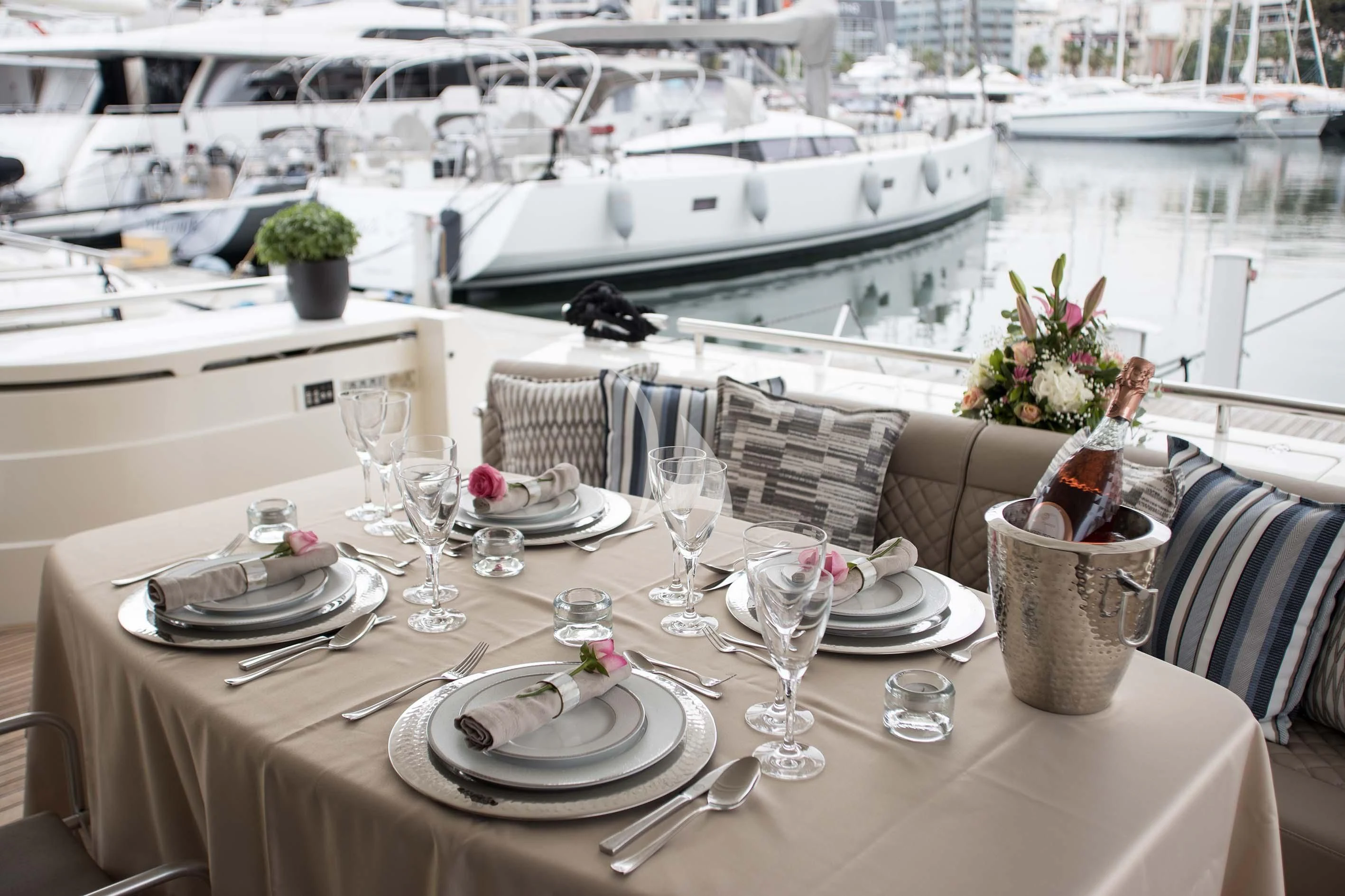 a table with plates and glasses on it aboard SOFIA D Yacht for Sale