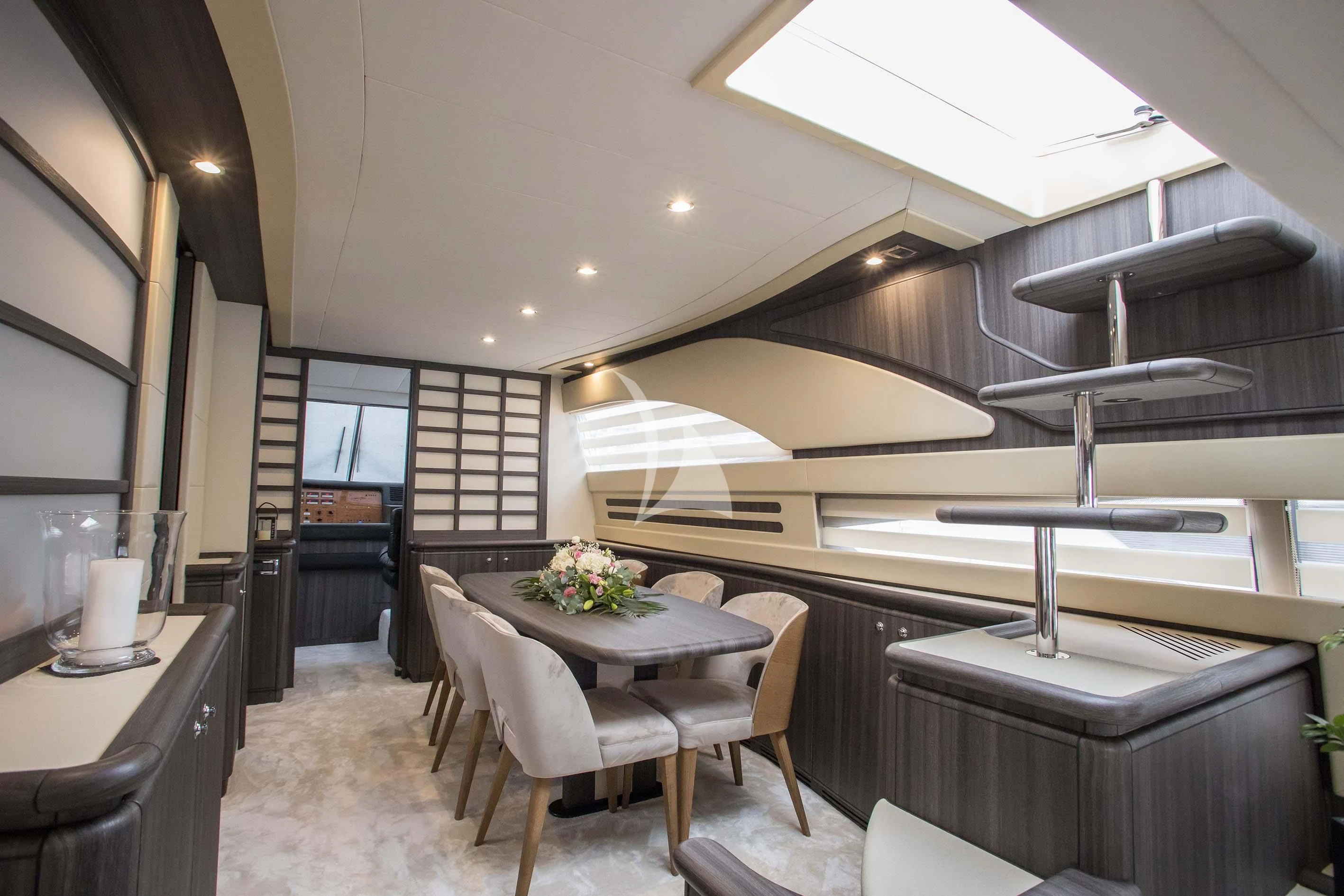 a kitchen with a table and chairs aboard SOFIA D Yacht for Sale