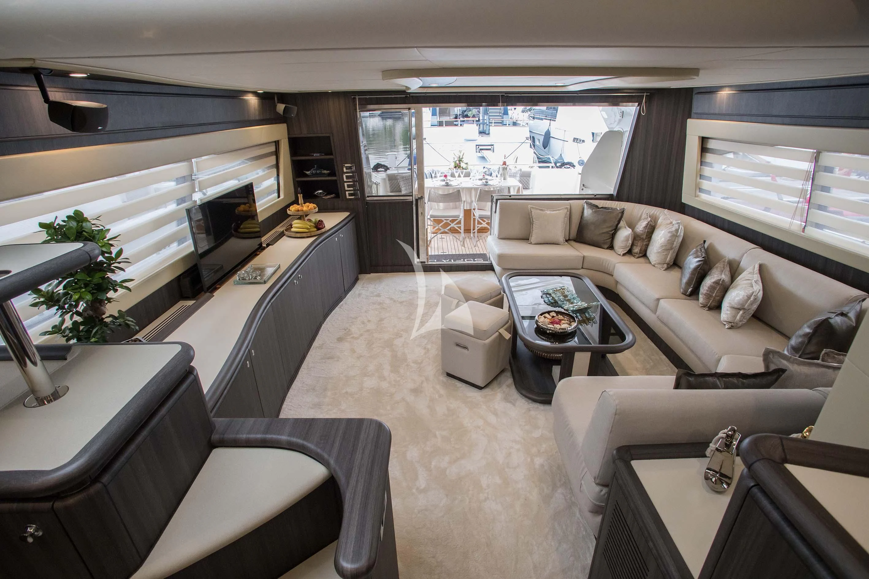 a living room with a couch and a table aboard SOFIA D Yacht for Sale
