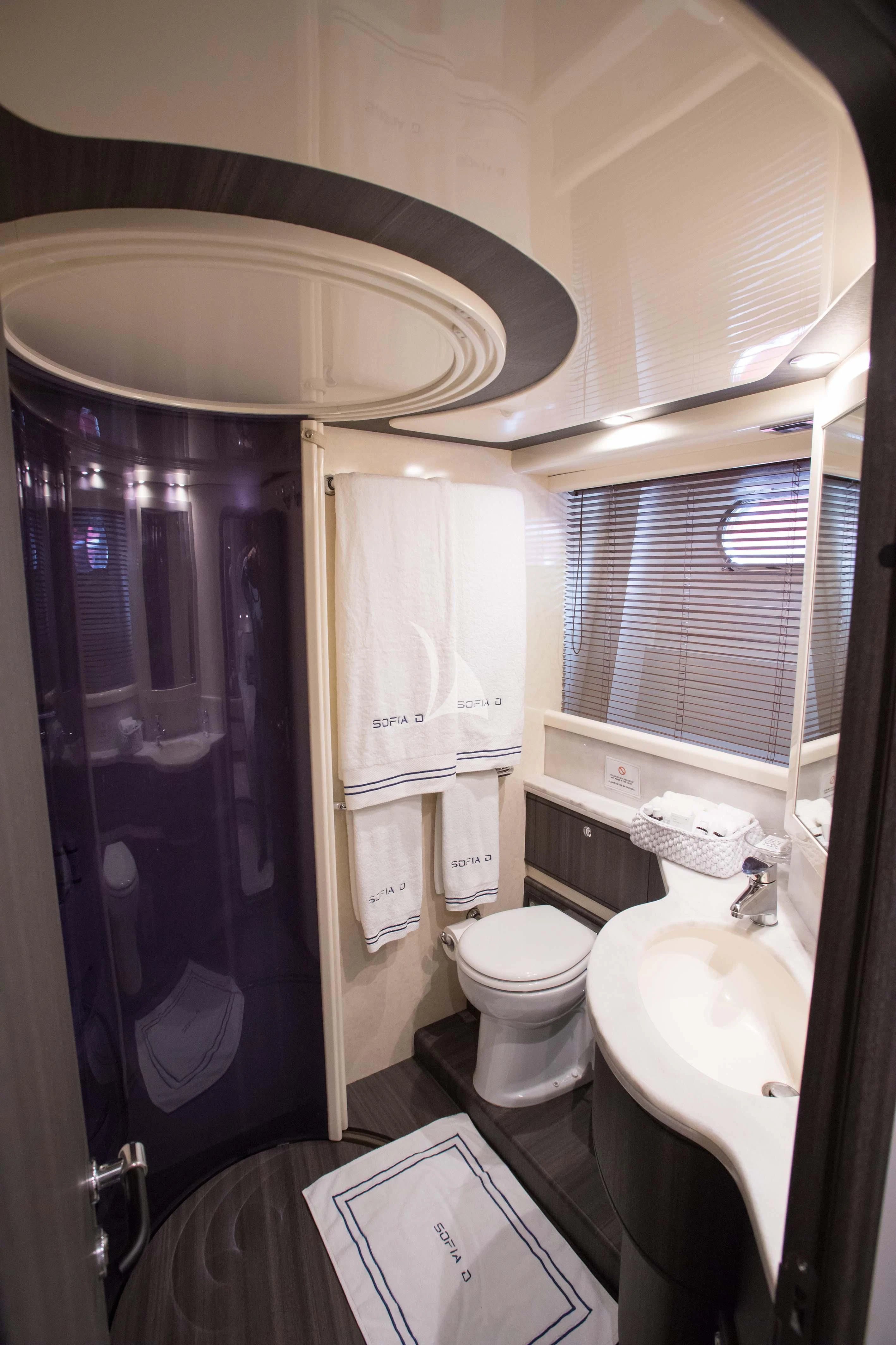 a bathroom with a sink toilet and a shower aboard SOFIA D Yacht for Sale