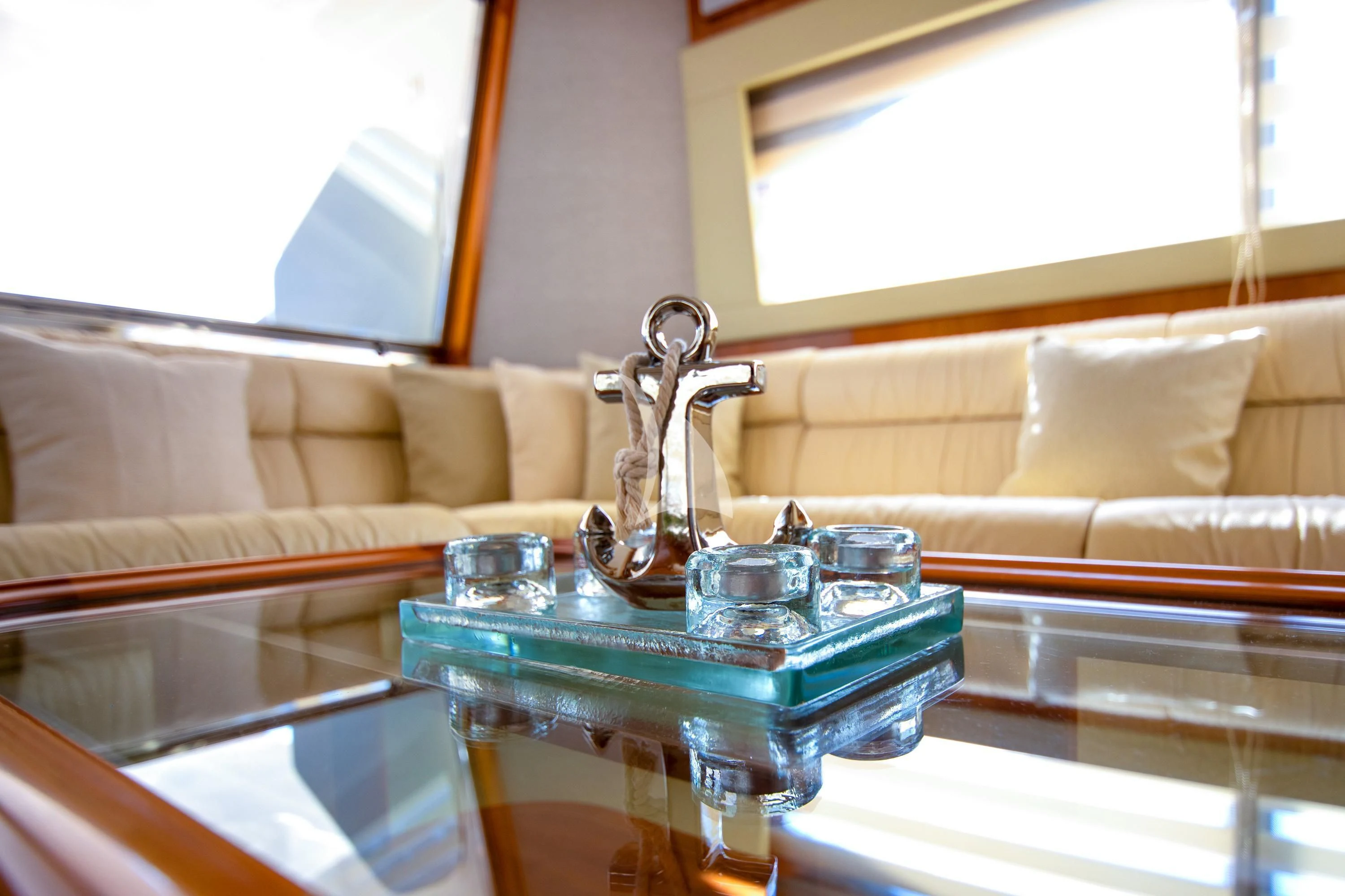 a glass table with a glass bowl and a glass on it aboard SOFIA D Yacht for Sale