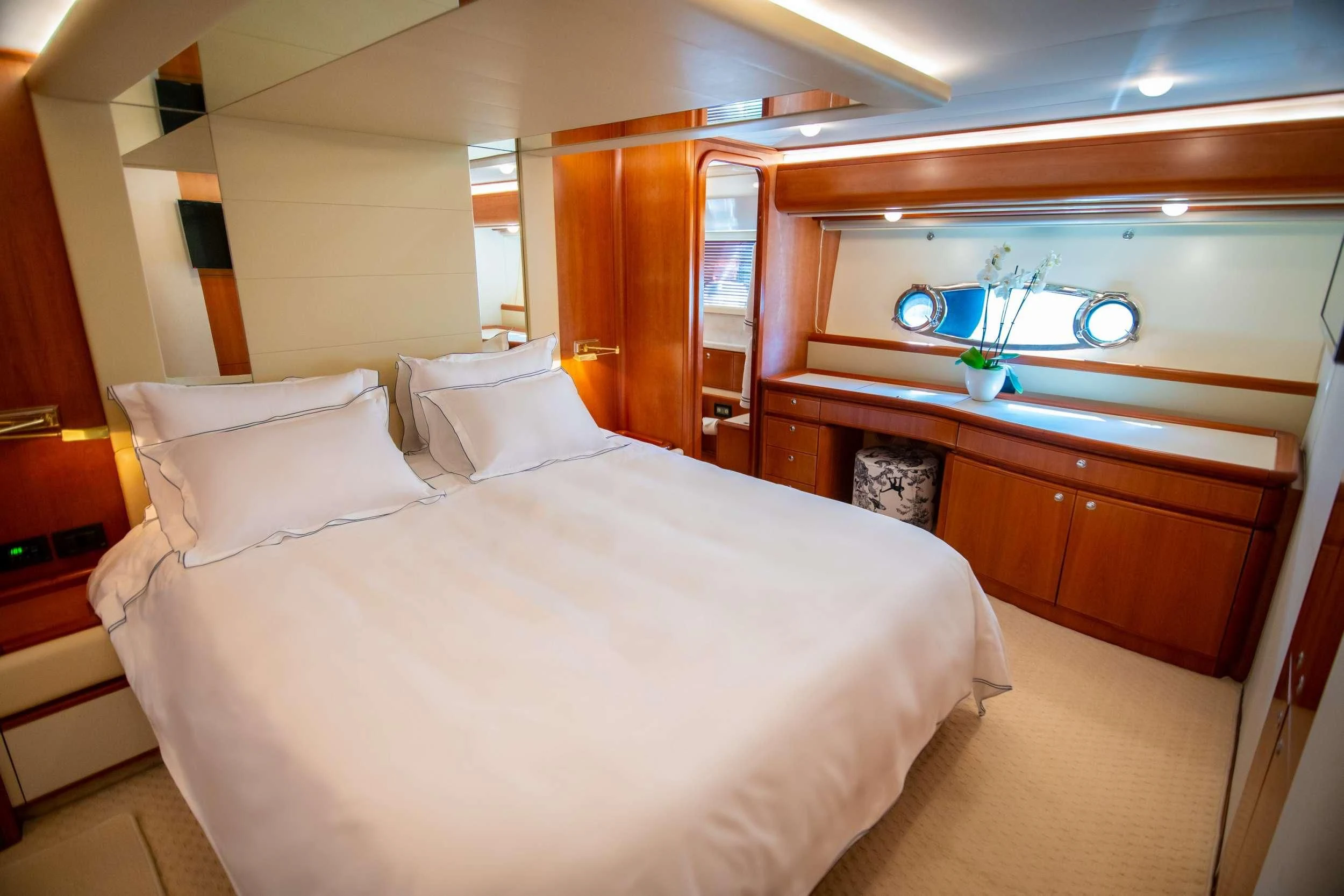 a bed with white sheets aboard SOFIA D Yacht for Sale