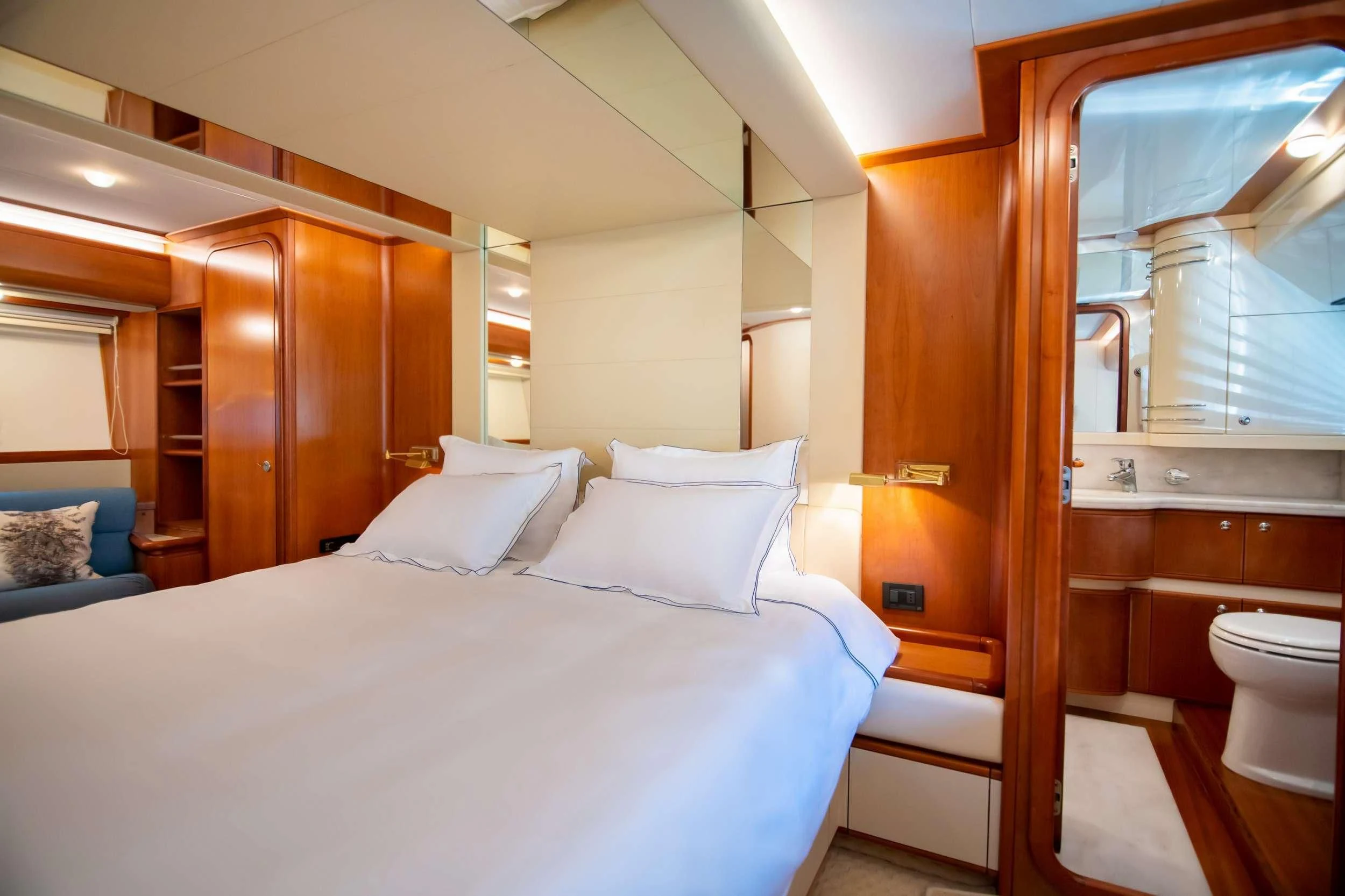 a room with a bed and a mirror aboard SOFIA D Yacht for Sale