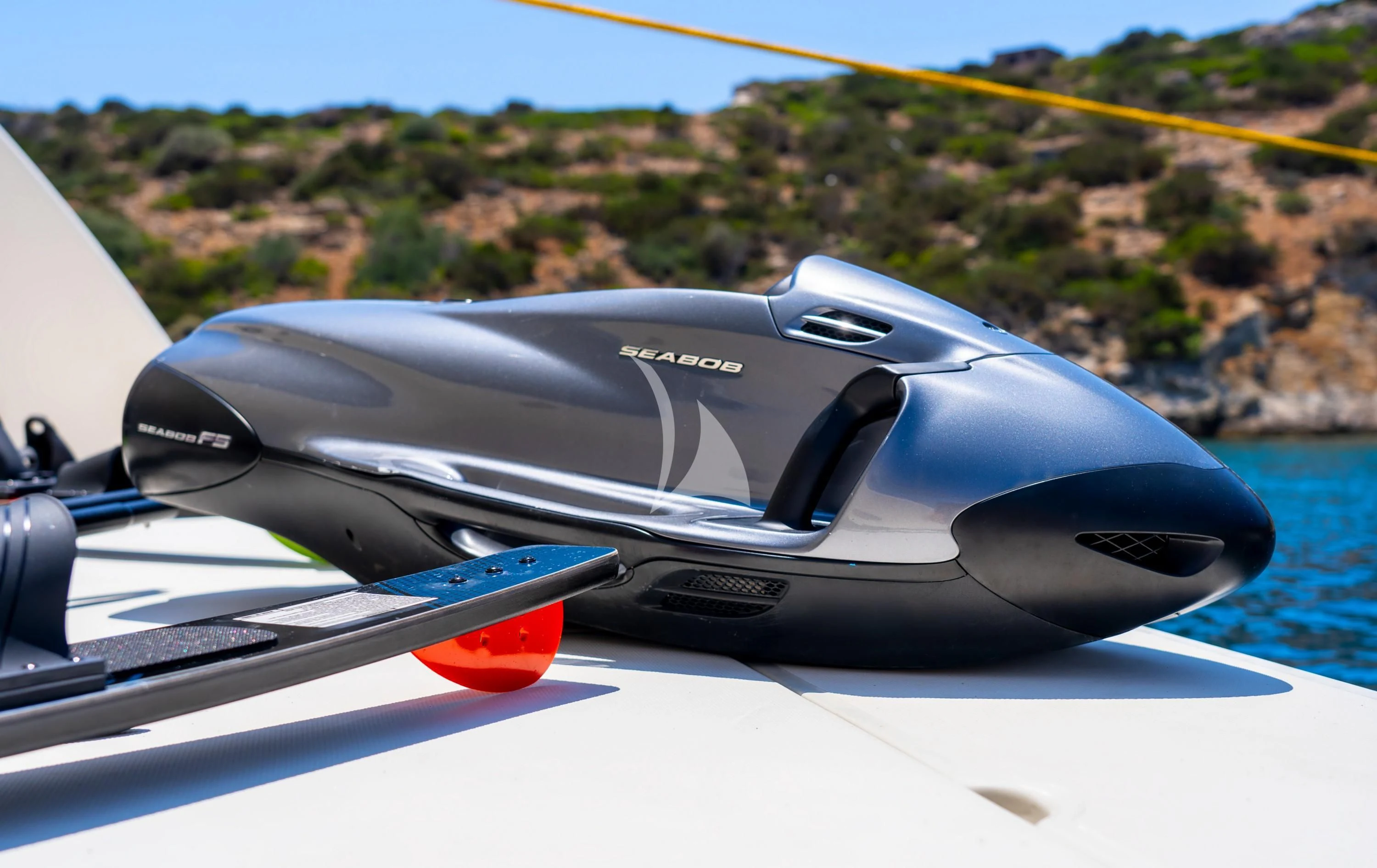 a black and red sports car aboard SOFIA D Yacht for Sale