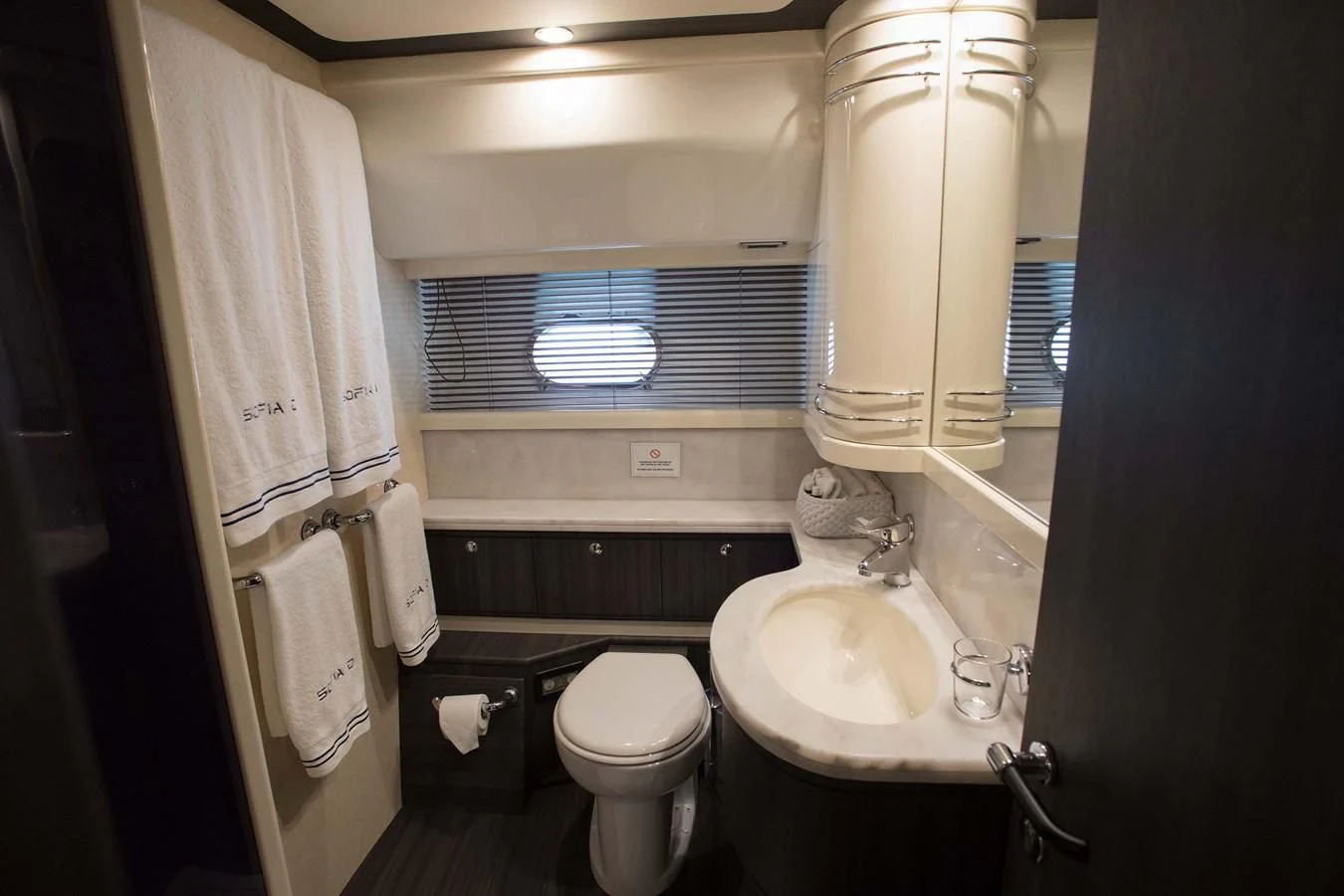 a bathroom with a toilet sink and a mirror aboard SOFIA D Yacht for Sale