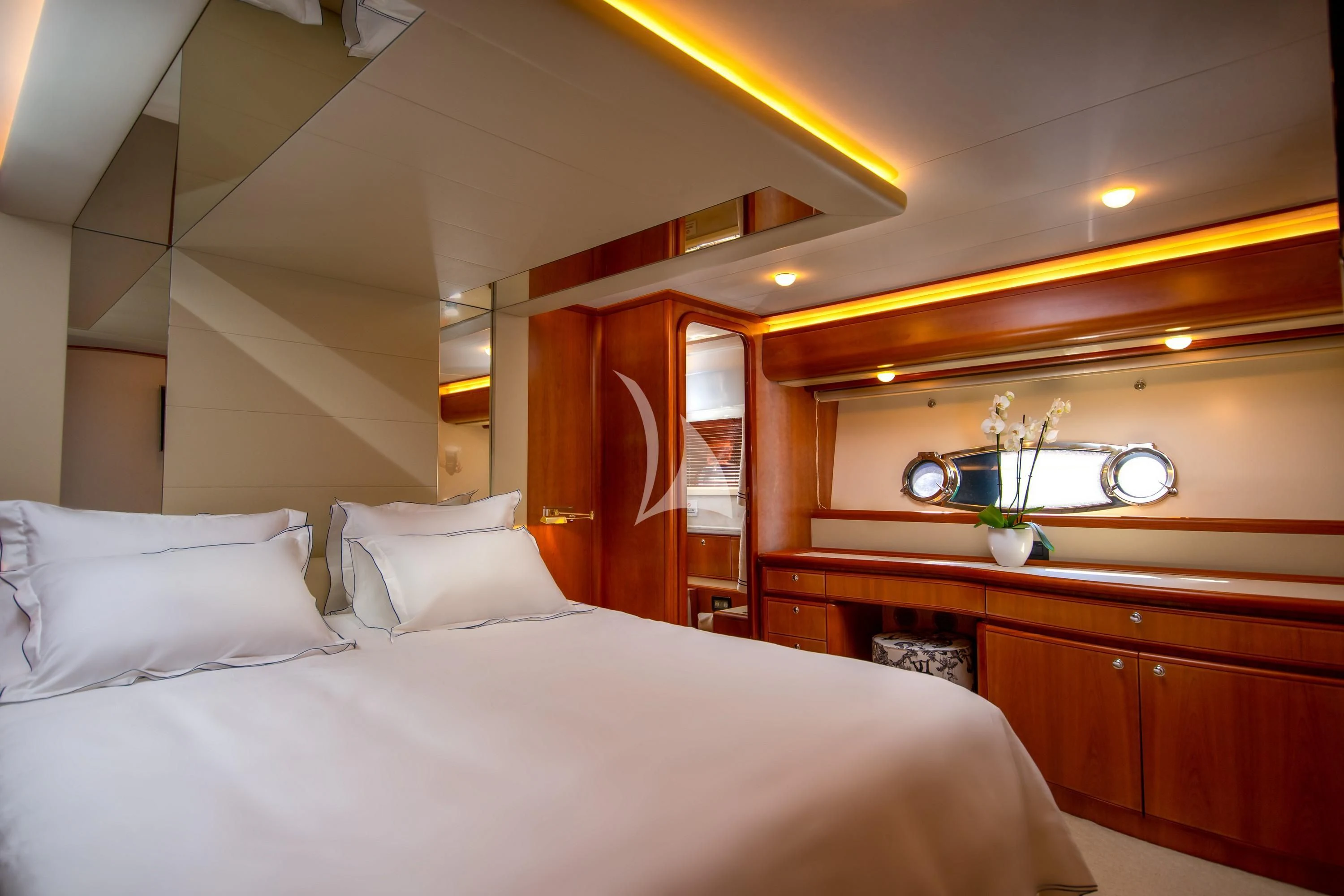a bed with white sheets and pillows aboard SOFIA D Yacht for Sale