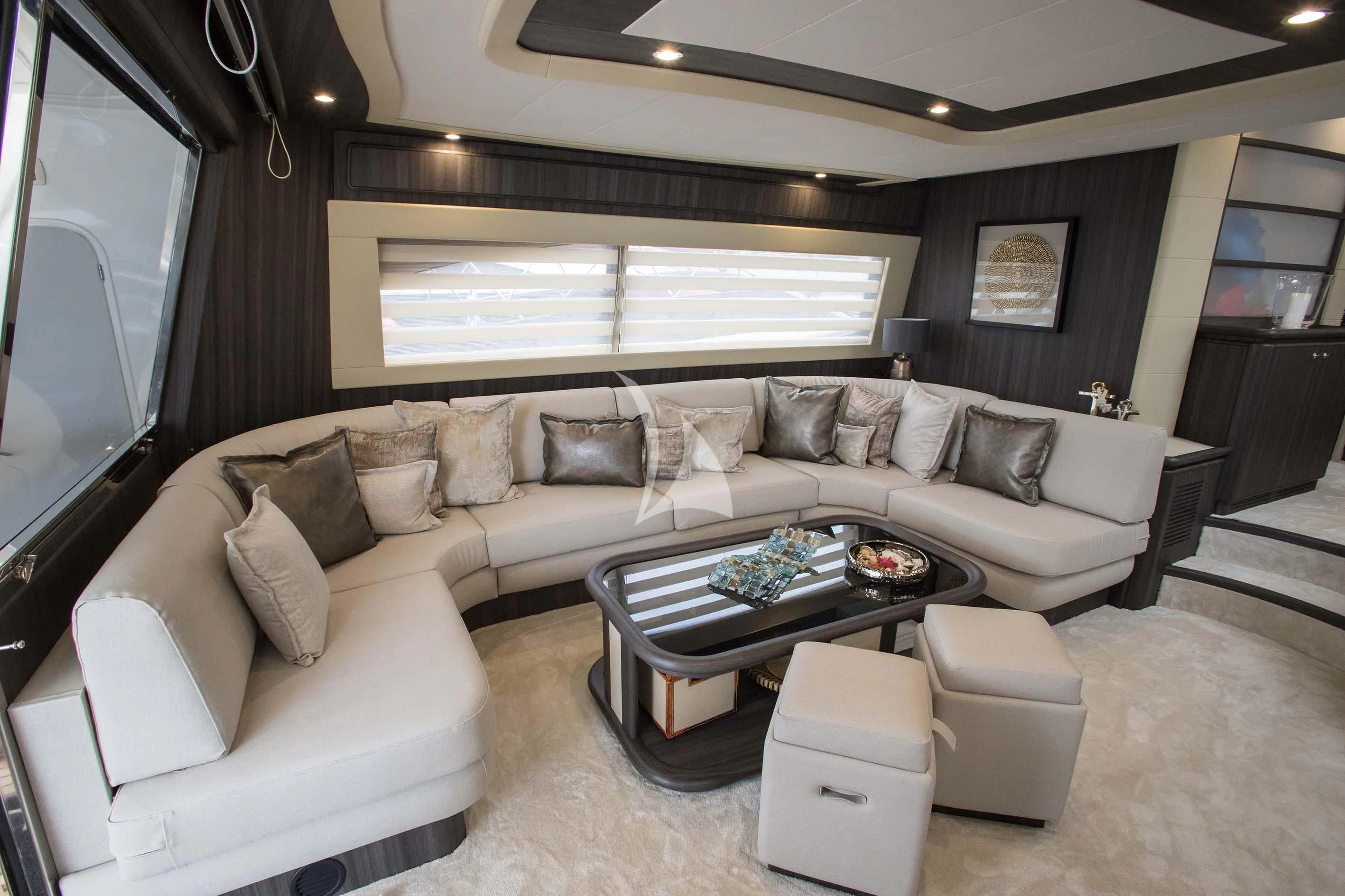 a living room with a large sofa aboard SOFIA D Yacht for Sale