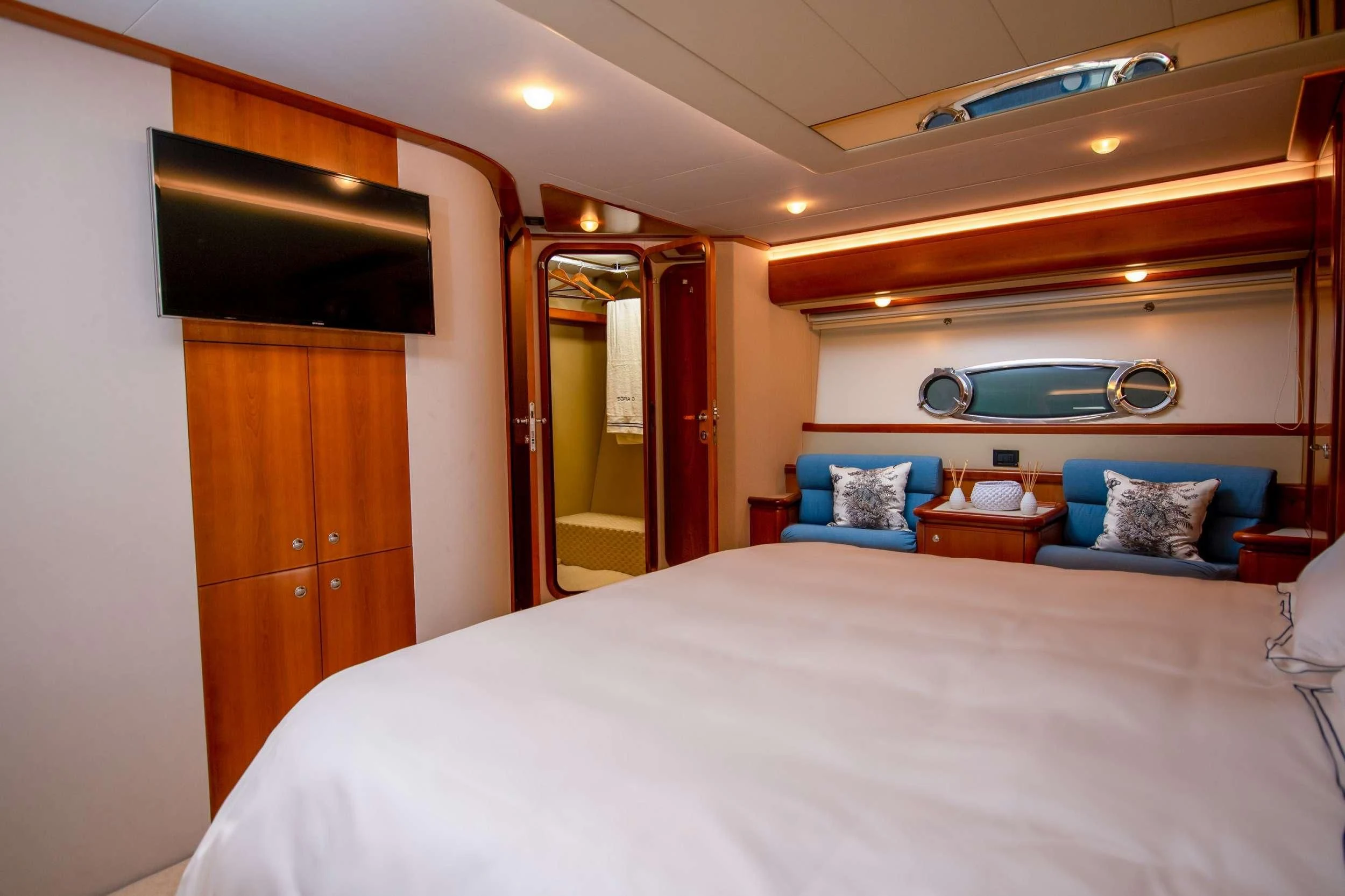 a bed with a white sheet aboard SOFIA D Yacht for Sale