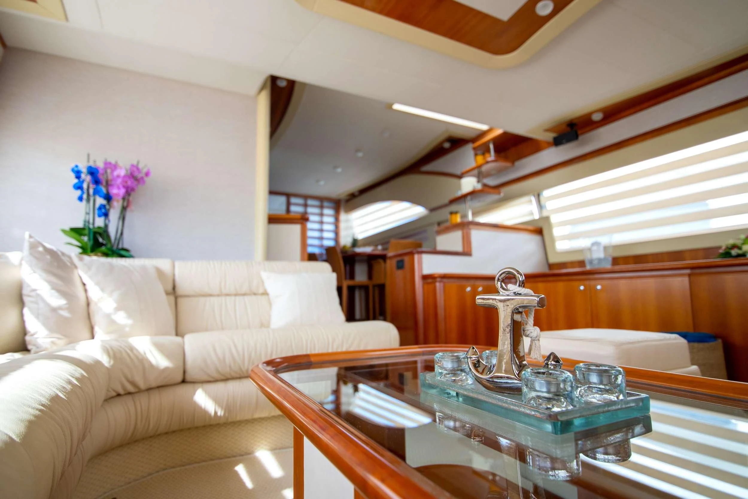 a living room with a white couch and a table aboard SOFIA D Yacht for Sale