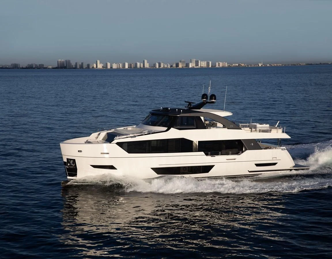 a white yacht on the water aboard MAKE BIG HAPPEN Yacht for Sale