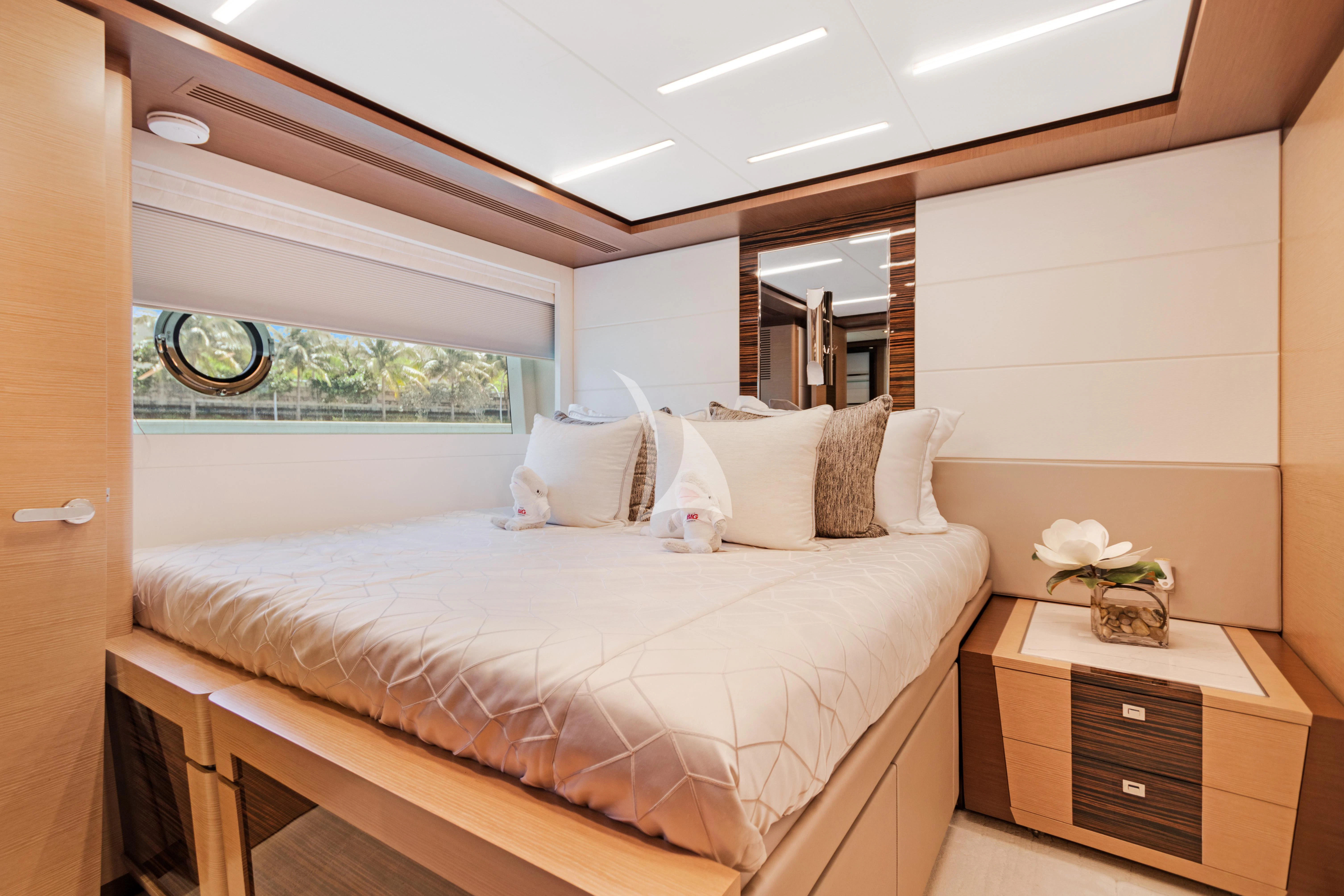 a bedroom with a large bed aboard MAKE BIG HAPPEN Yacht for Sale