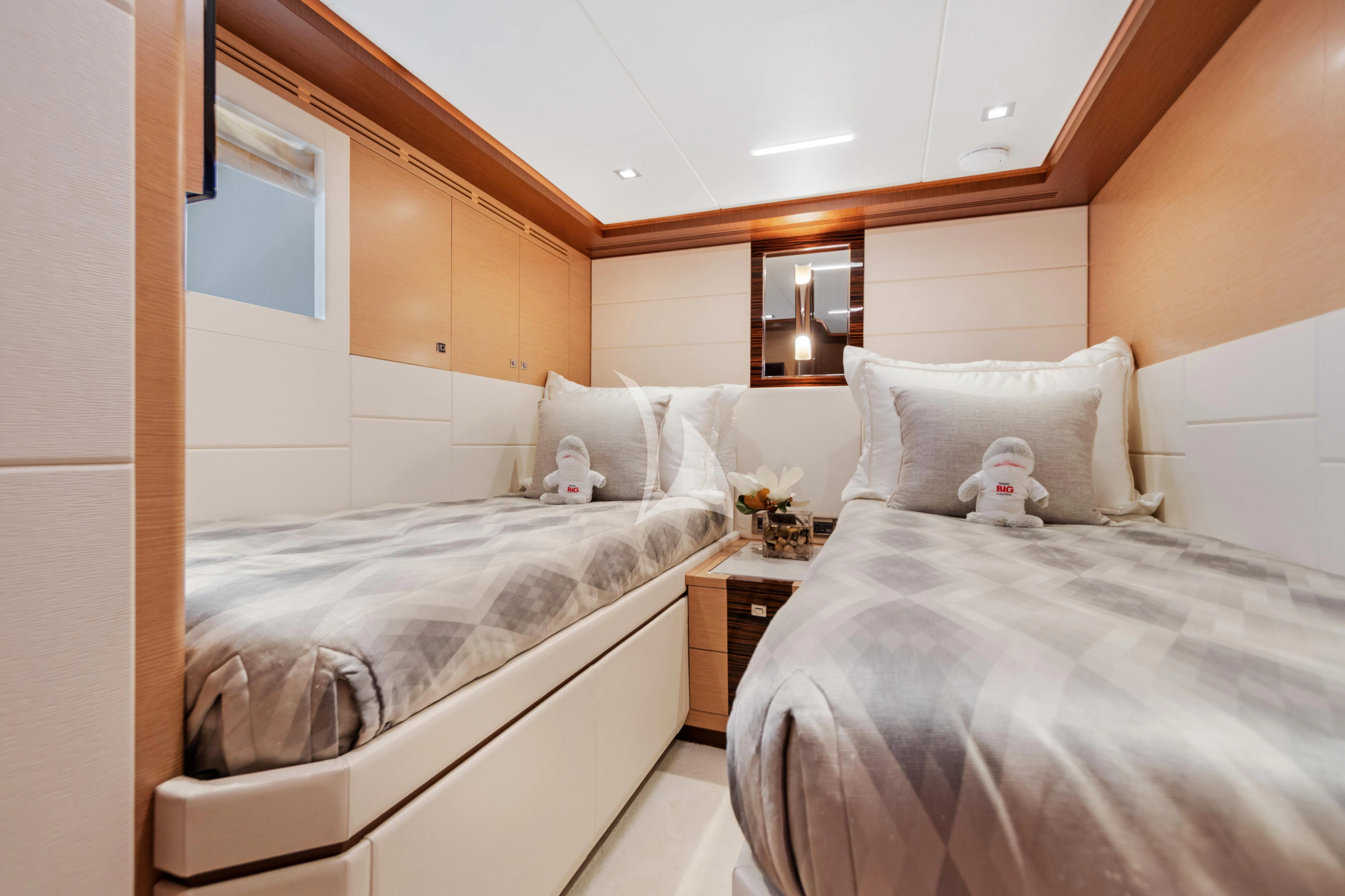a bedroom with two beds aboard MAKE BIG HAPPEN Yacht for Sale