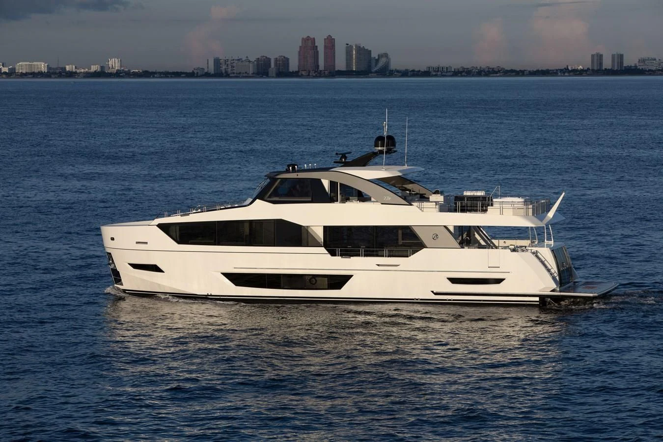a white yacht in the water aboard MAKE BIG HAPPEN Yacht for Sale