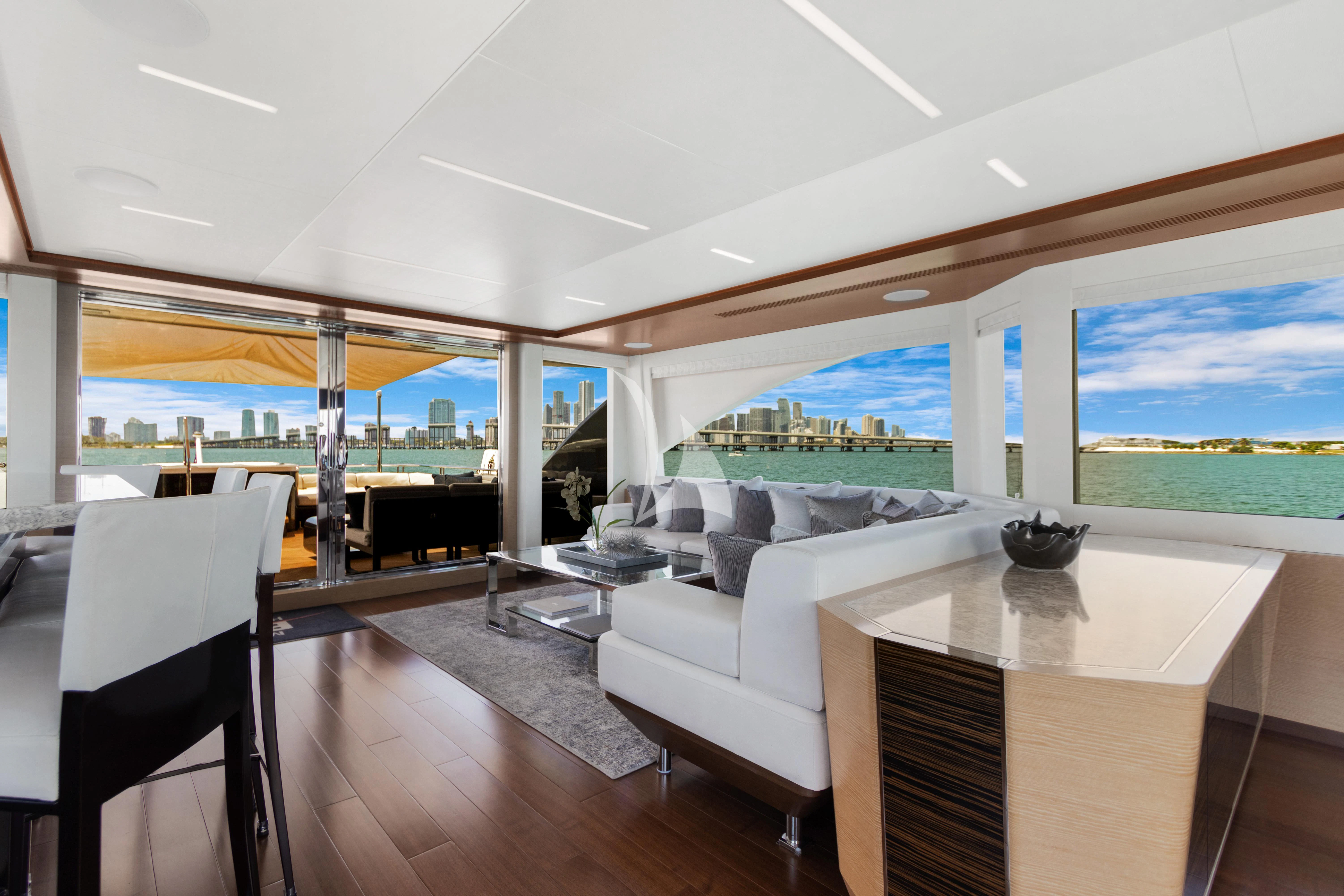 a living room with a large window aboard MAKE BIG HAPPEN Yacht for Sale