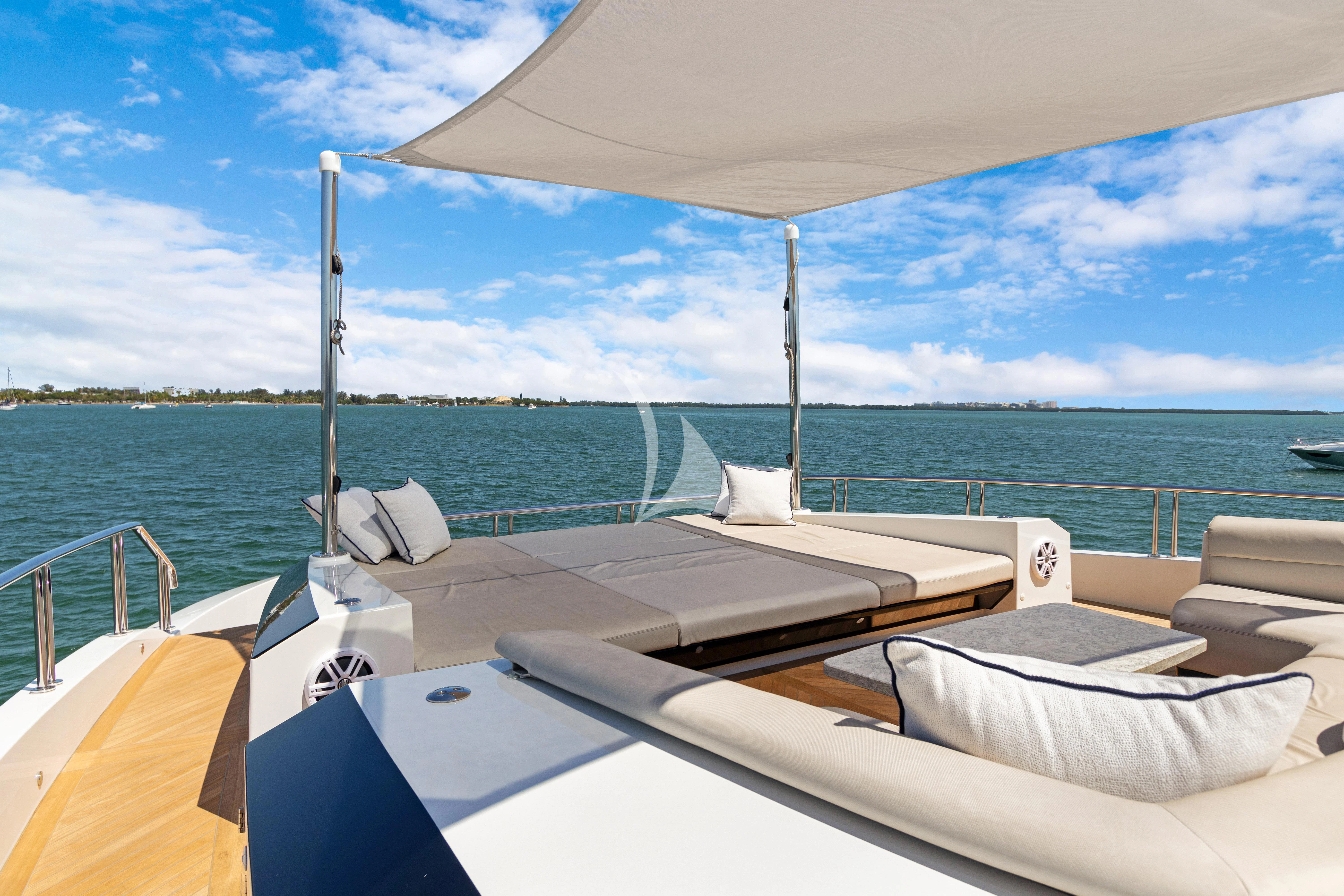 a boat with white pillows on a body of water aboard MAKE BIG HAPPEN Yacht for Sale