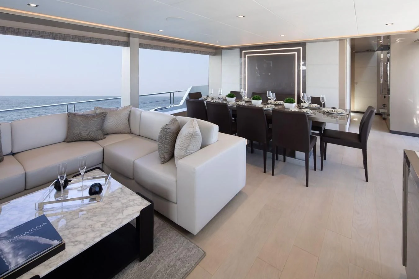 a living room with a large window aboard MAKE BIG HAPPEN Yacht for Sale