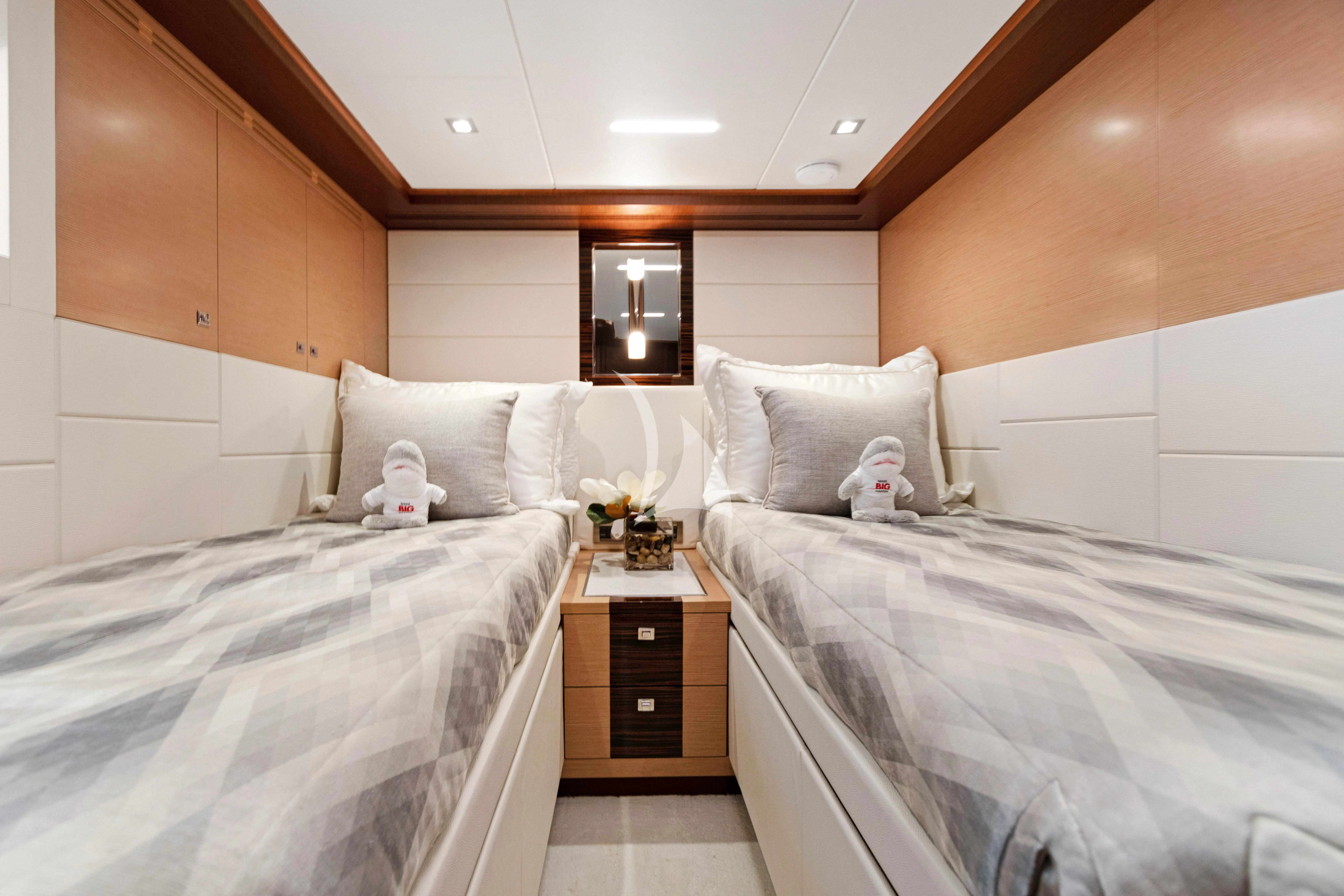 a room with two beds aboard MAKE BIG HAPPEN Yacht for Sale