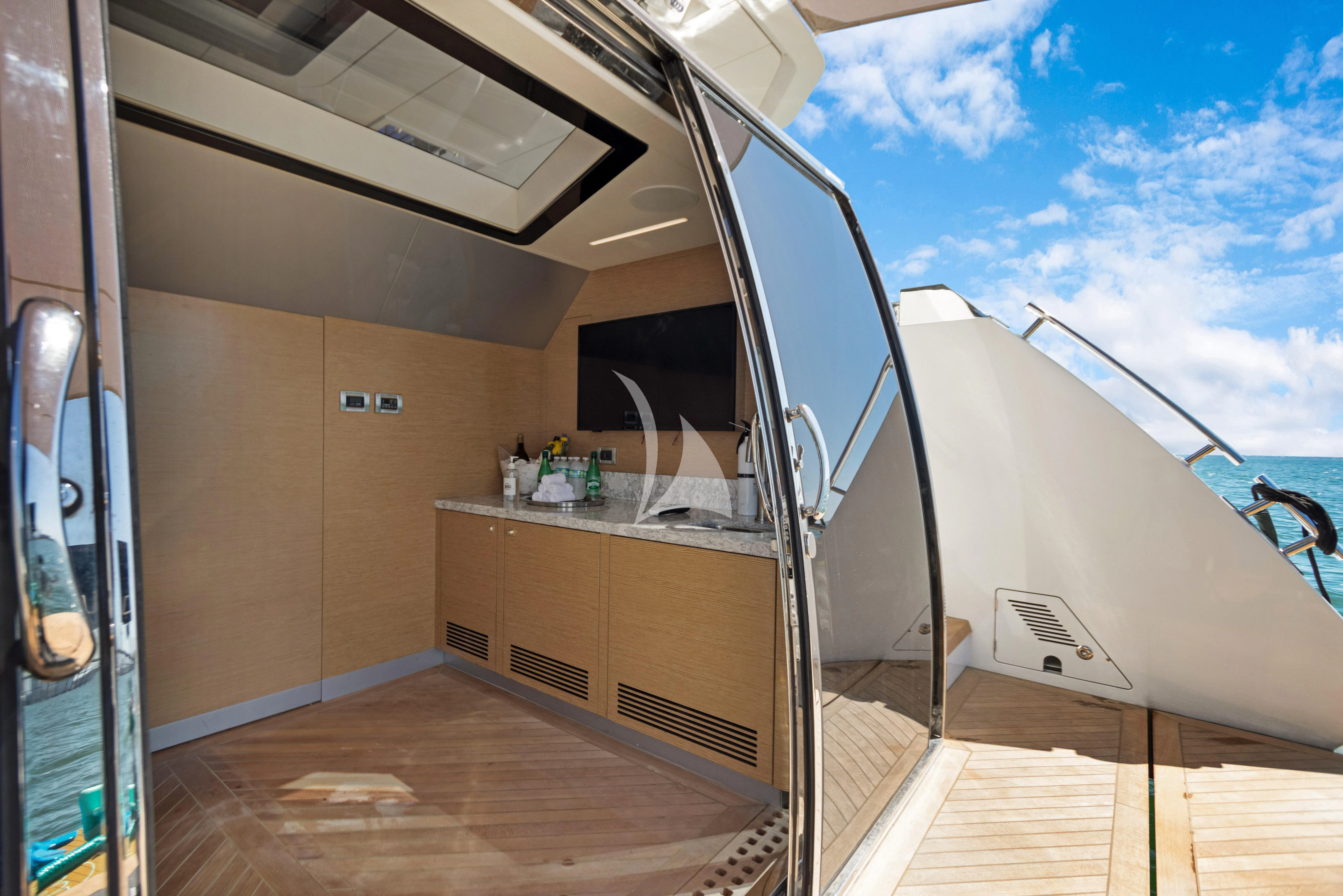 a room with a large window and a view of the ocean aboard MAKE BIG HAPPEN Yacht for Sale