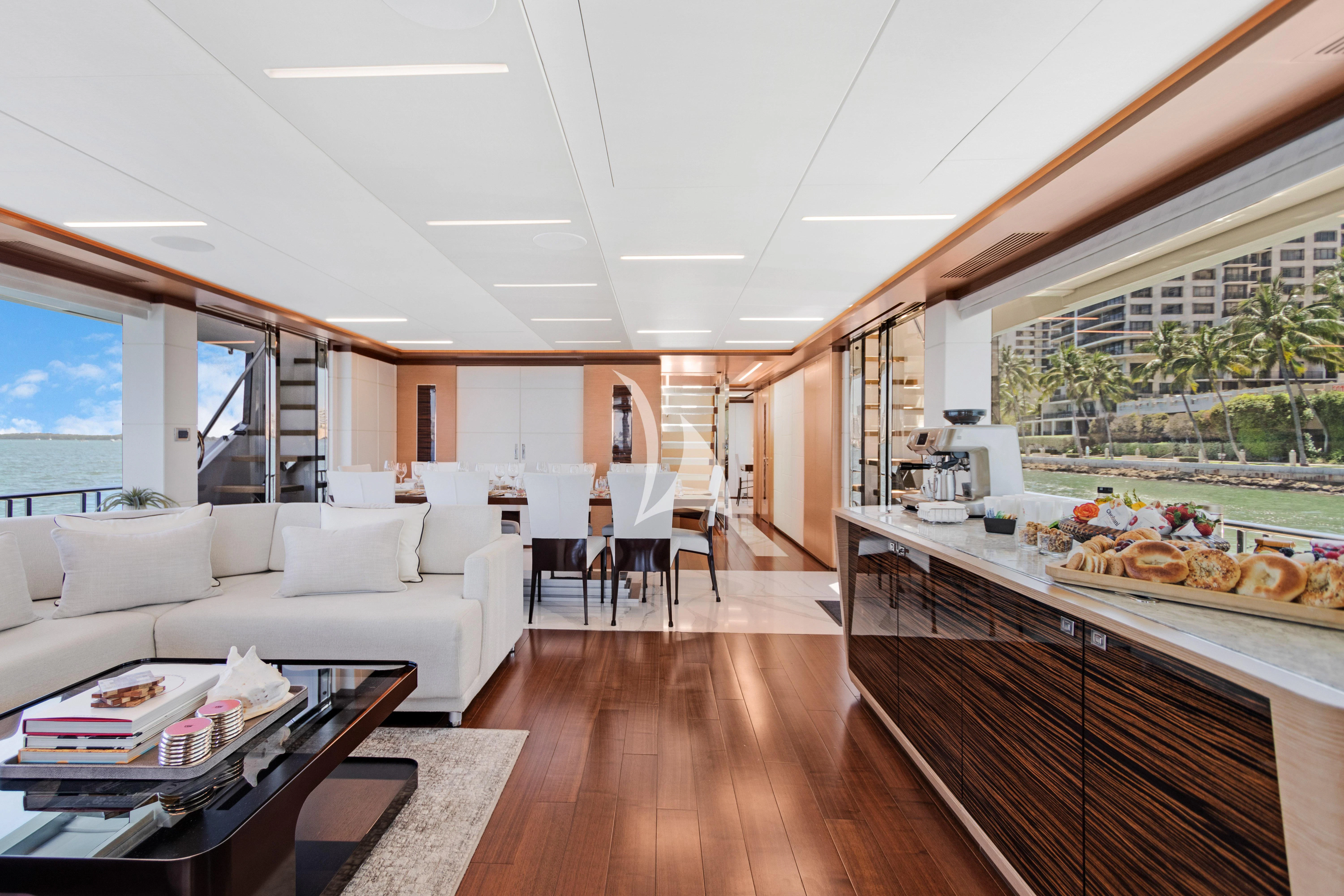 a living room with a large window aboard MAKE BIG HAPPEN Yacht for Sale