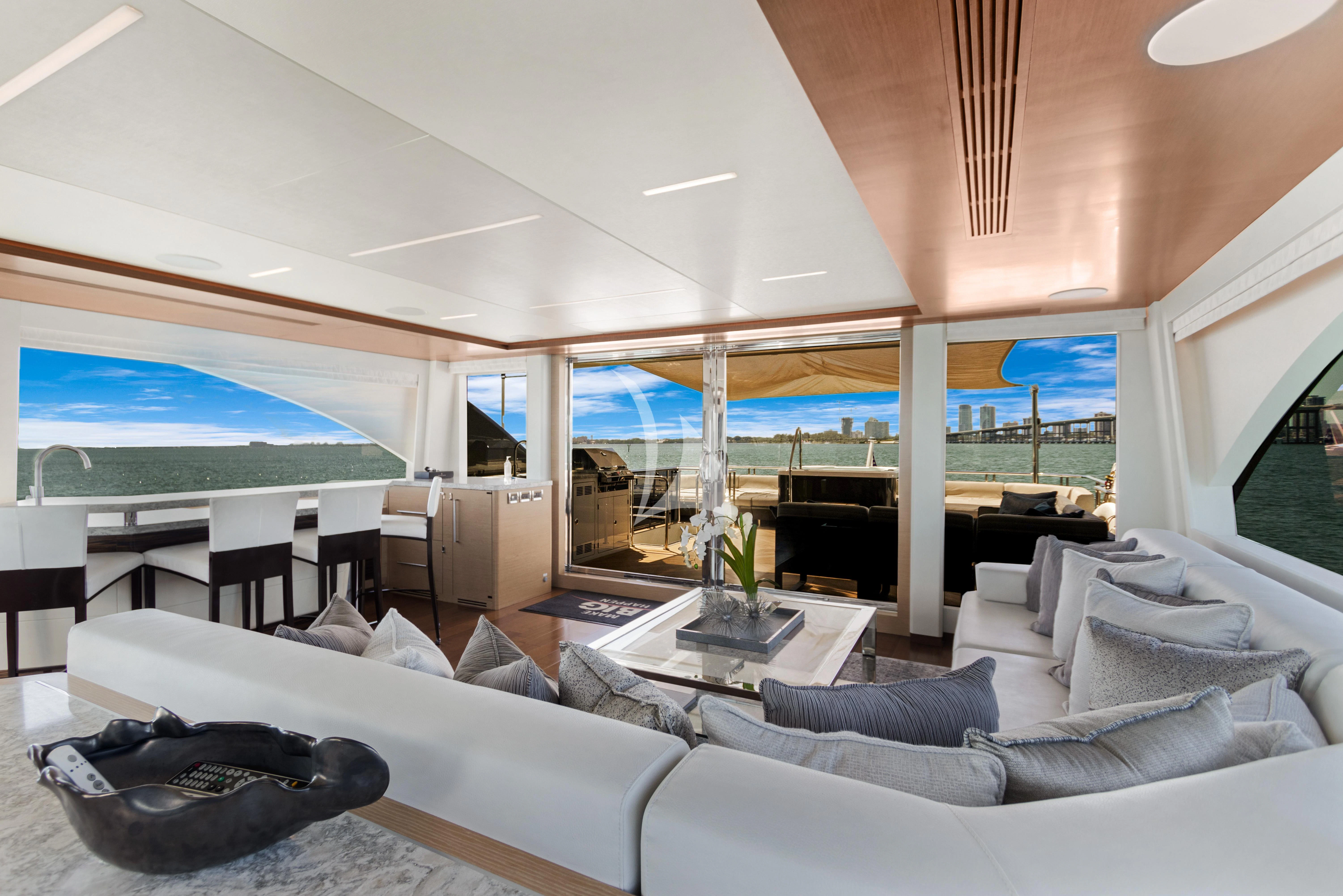 a living room with a large window aboard MAKE BIG HAPPEN Yacht for Sale