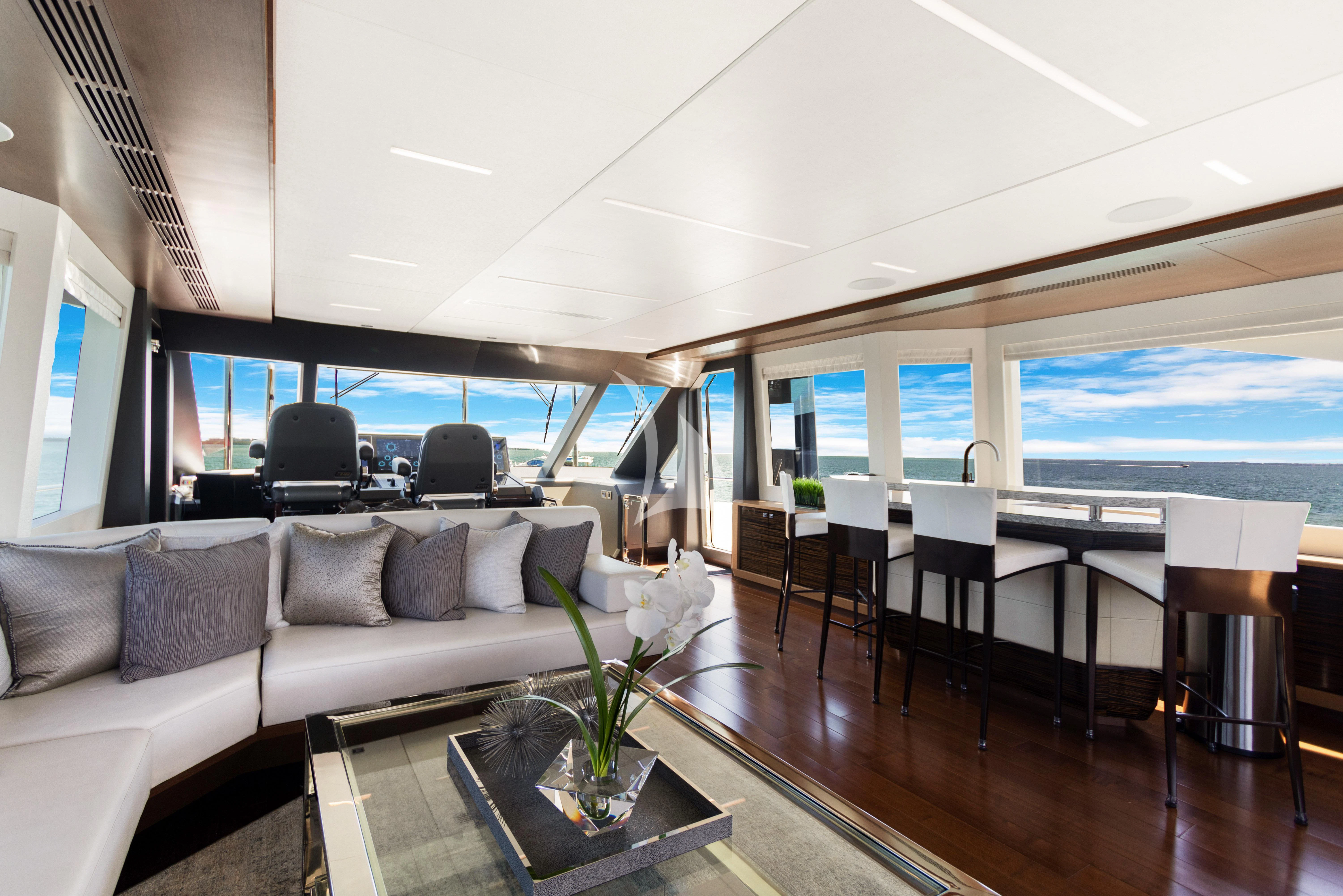 a living room with a large window aboard MAKE BIG HAPPEN Yacht for Sale