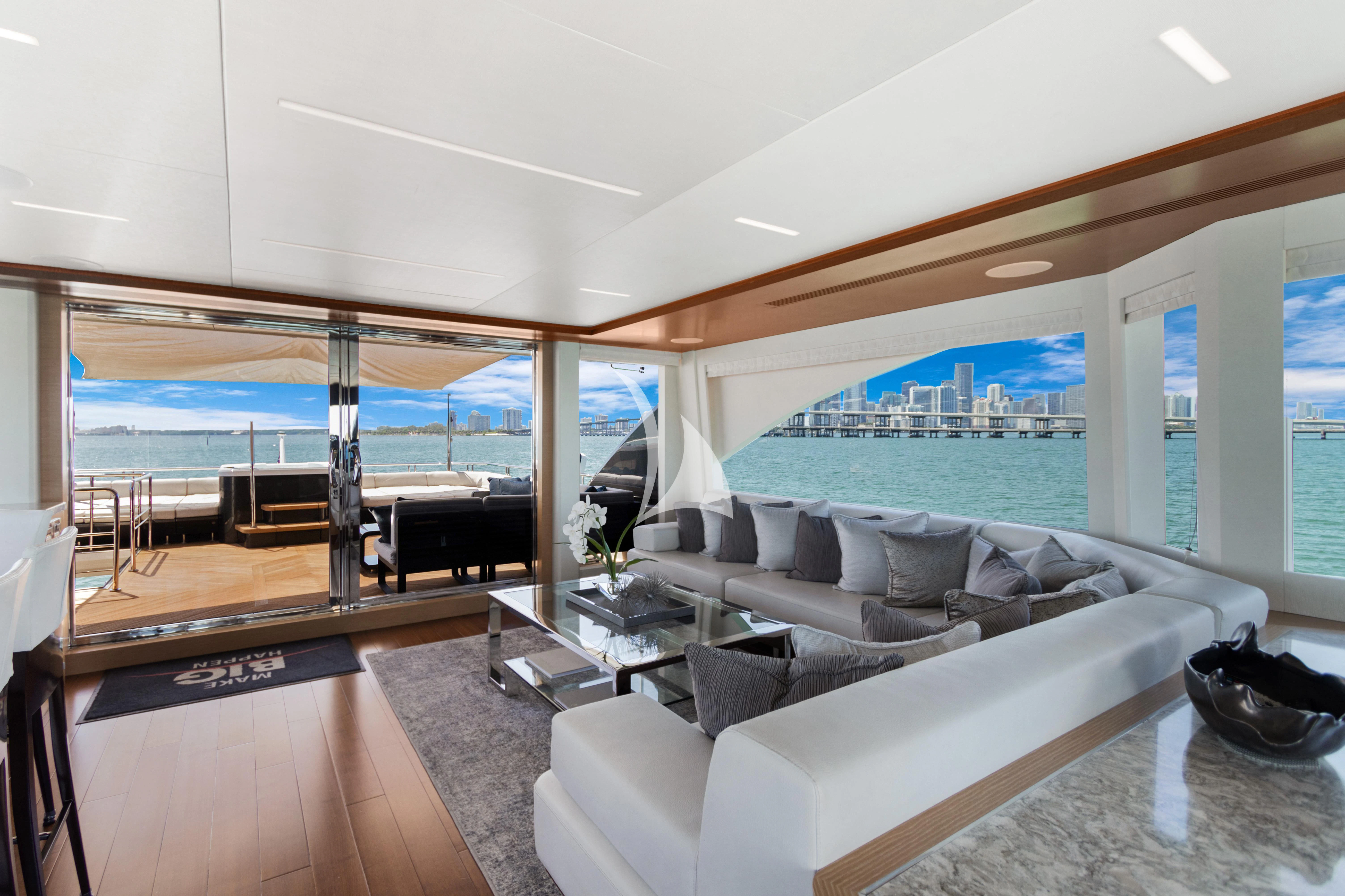 a living room with a large window aboard MAKE BIG HAPPEN Yacht for Sale