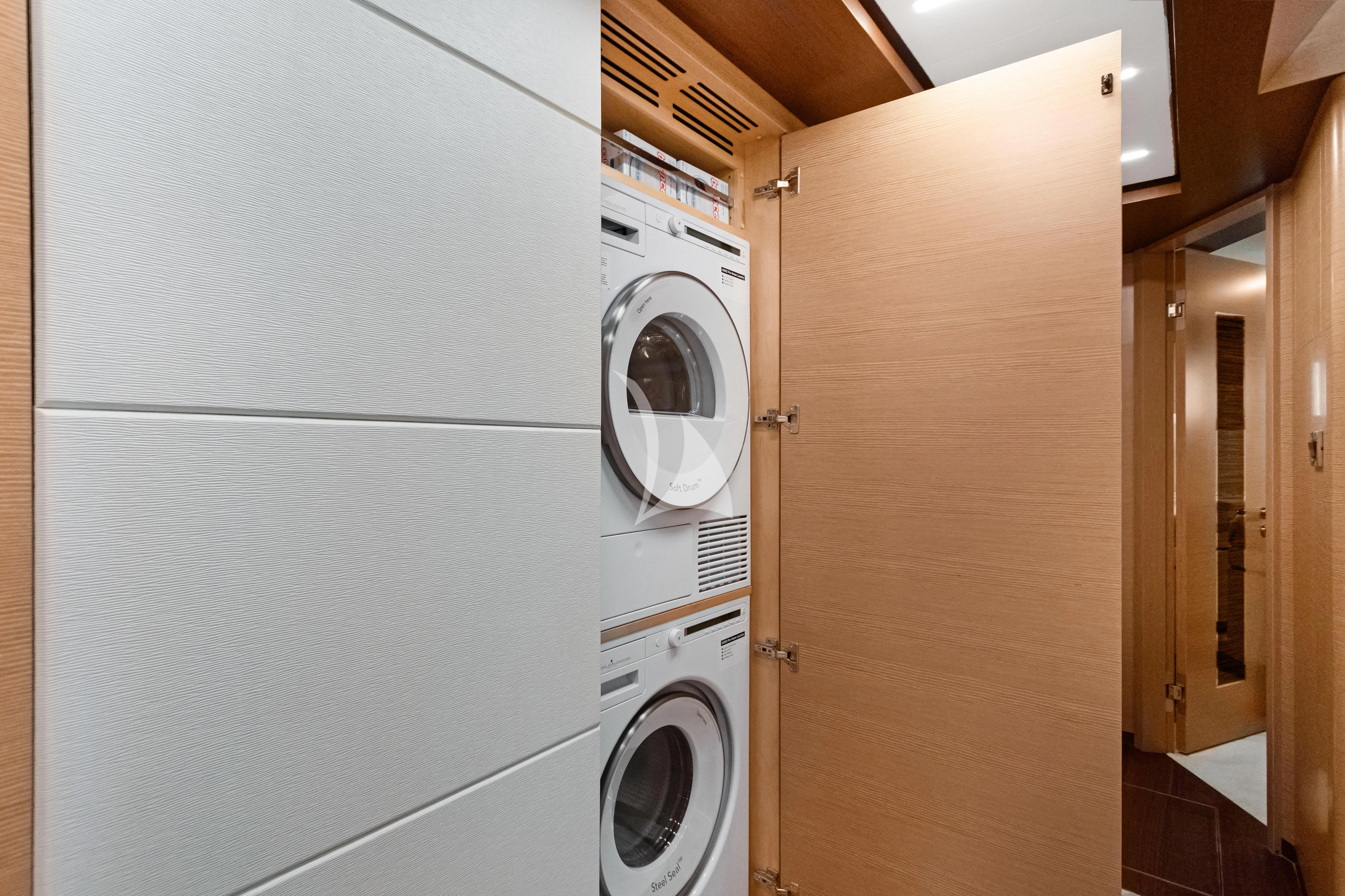 a white laundry room aboard MAKE BIG HAPPEN Yacht for Sale