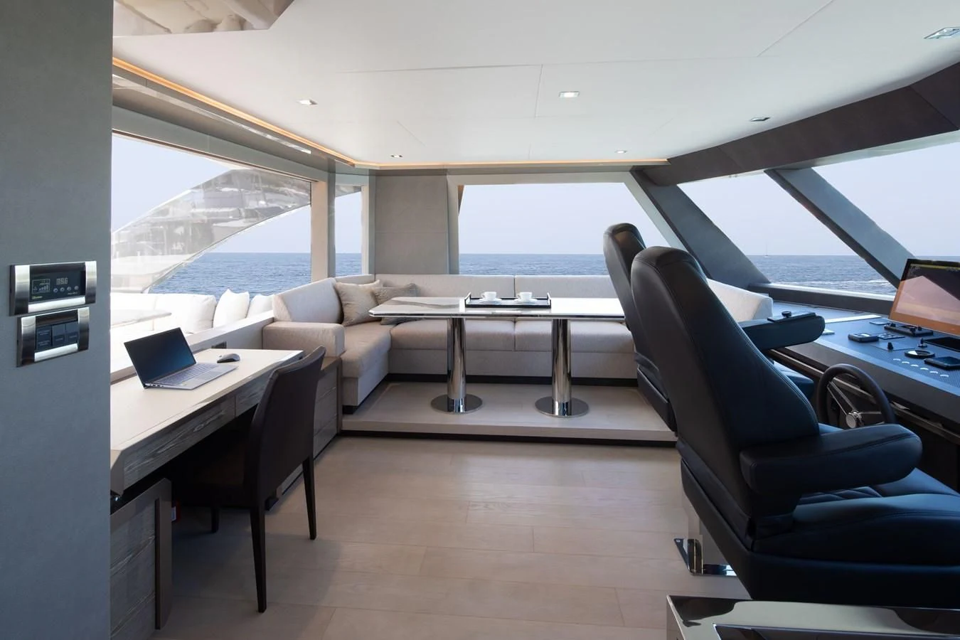 a room with a table and chairs aboard MAKE BIG HAPPEN Yacht for Sale