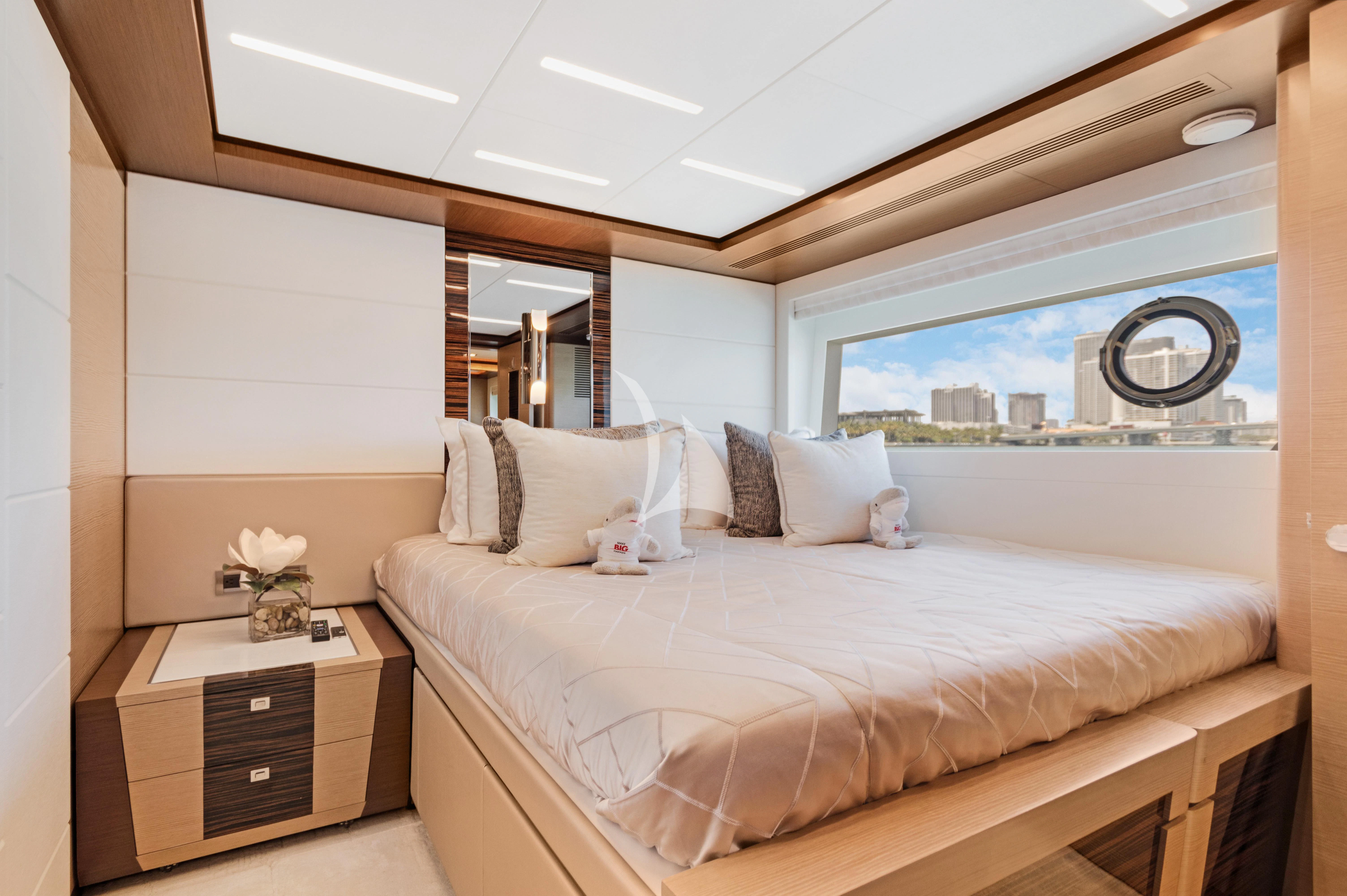 a bedroom with a large bed aboard MAKE BIG HAPPEN Yacht for Sale