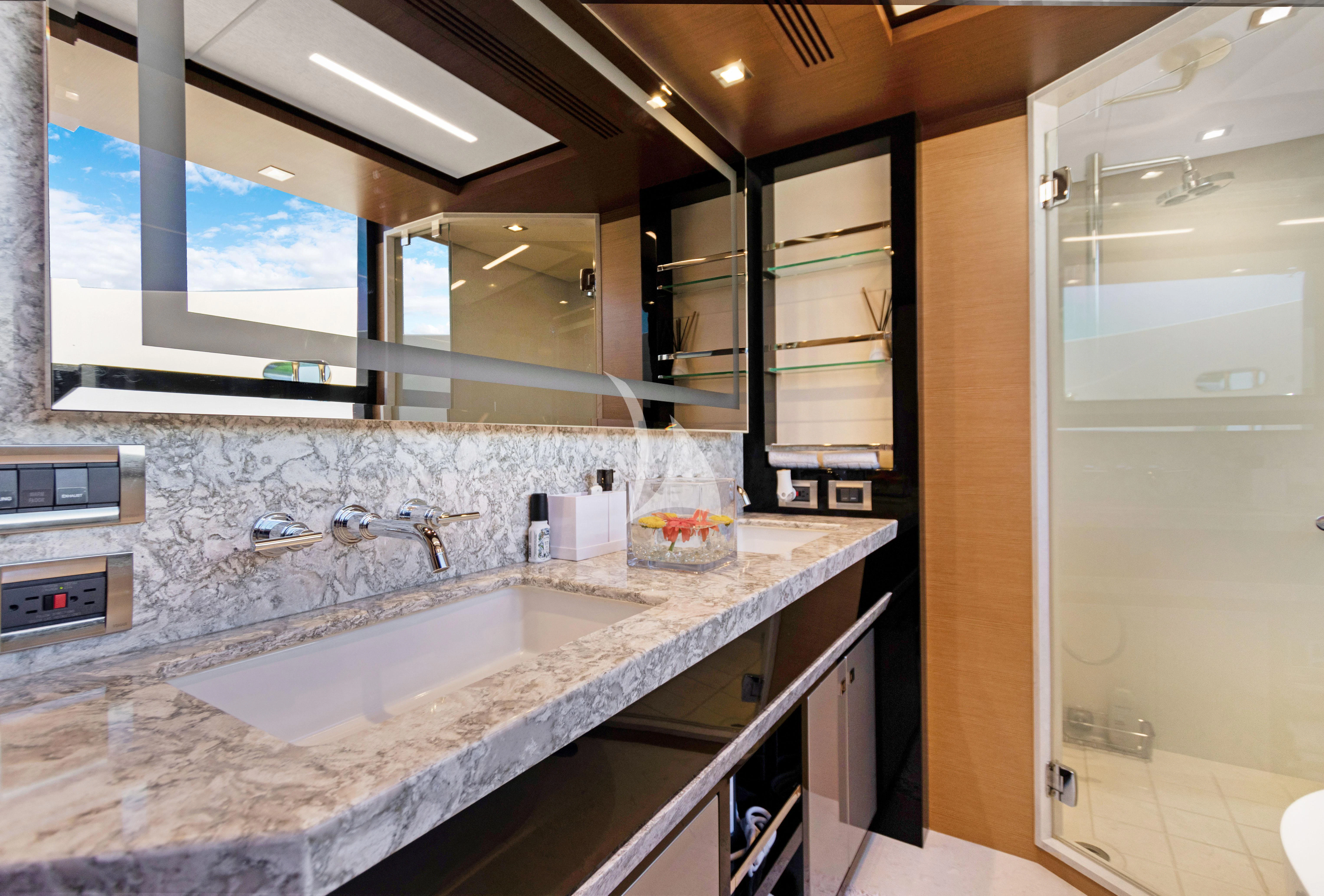 a bathroom with a sink and a mirror aboard MAKE BIG HAPPEN Yacht for Sale
