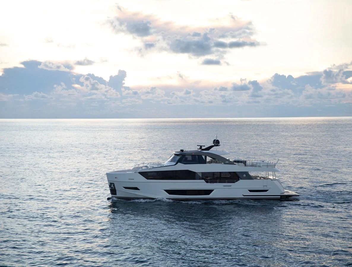 a white yacht in the water aboard MAKE BIG HAPPEN Yacht for Sale