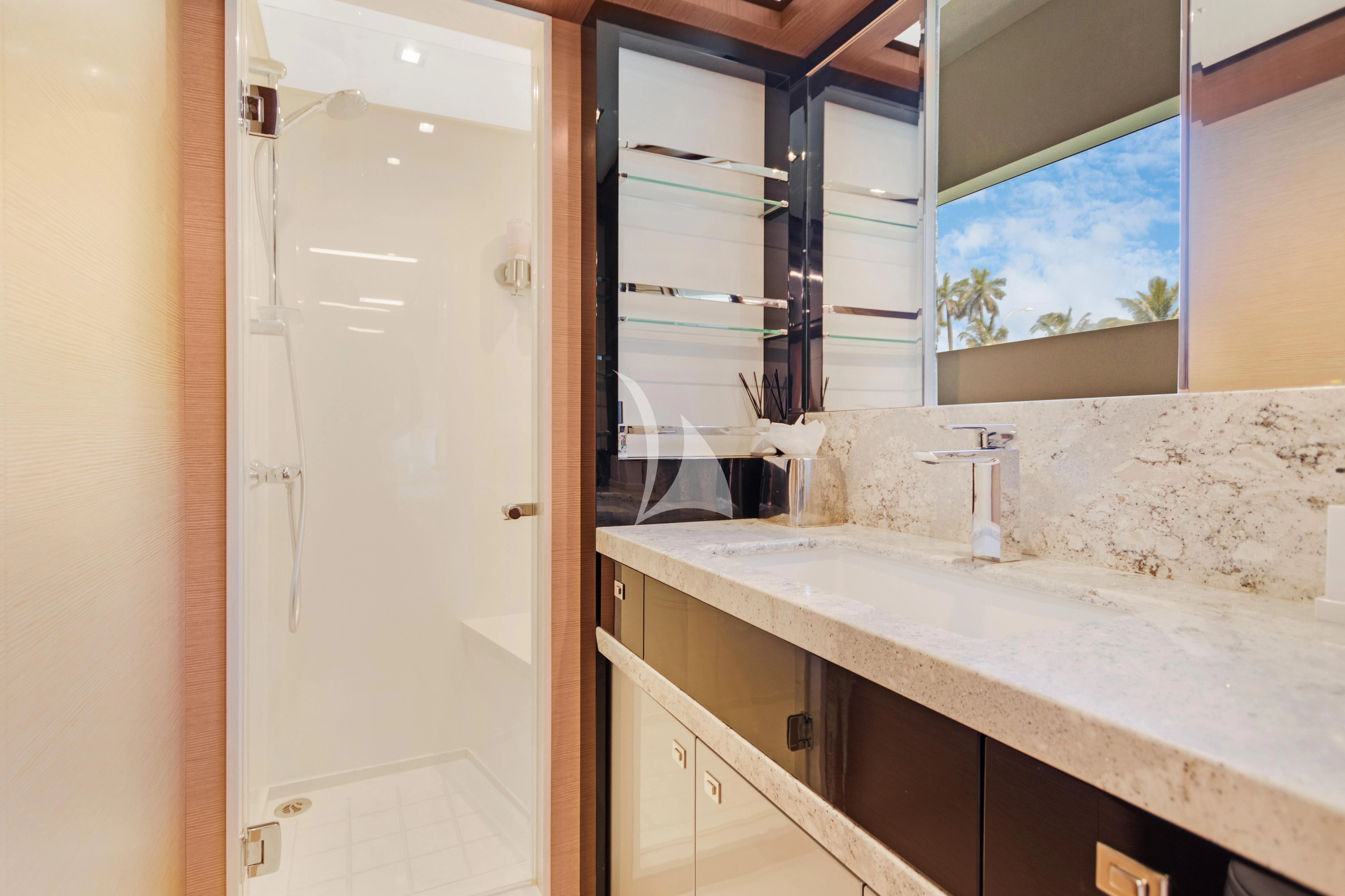 a bathroom with a sink and a window aboard MAKE BIG HAPPEN Yacht for Sale