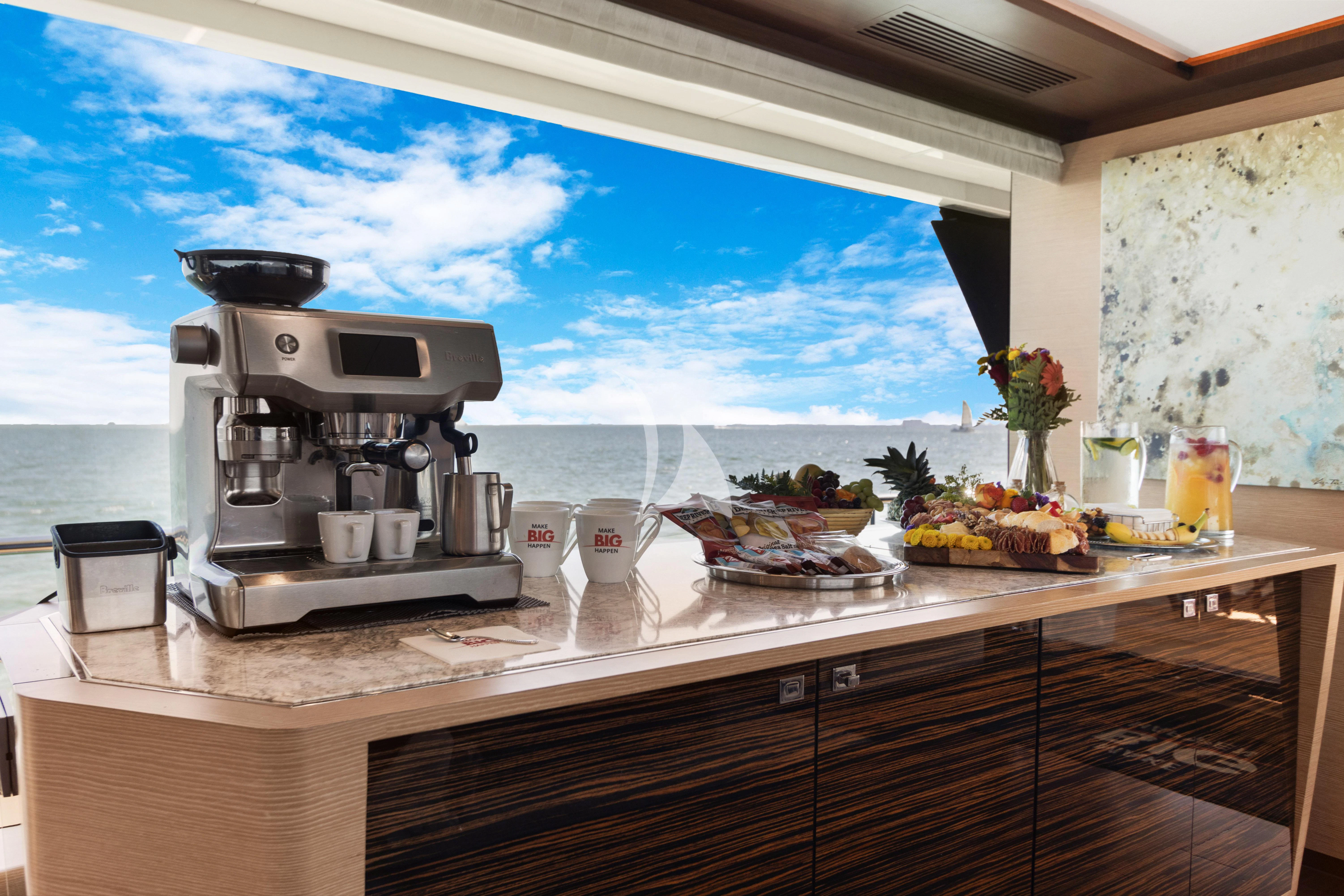 a kitchen with a large window aboard MAKE BIG HAPPEN Yacht for Sale